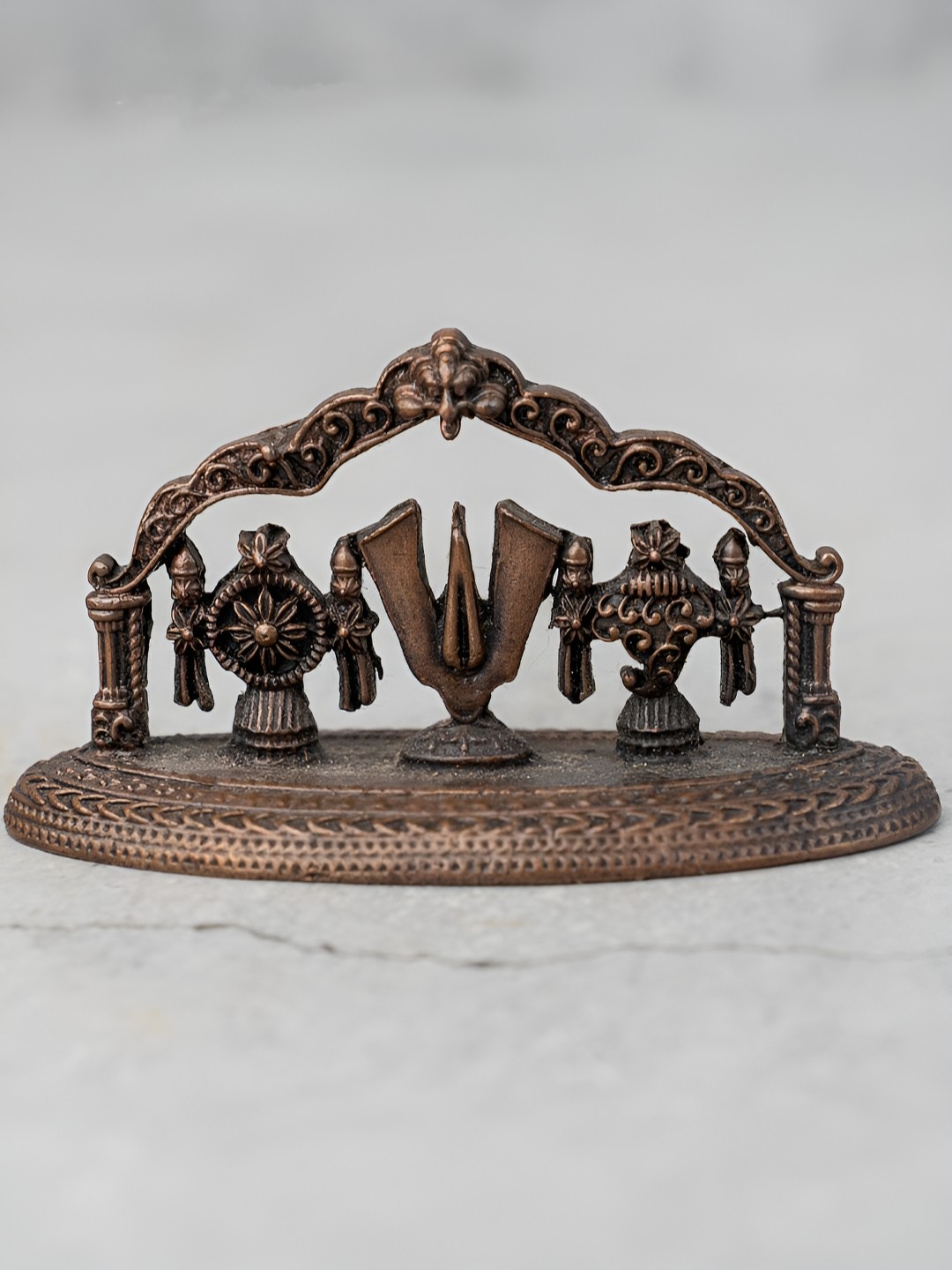 

The Advitya Copper-Toned Religious Curio Showpiece