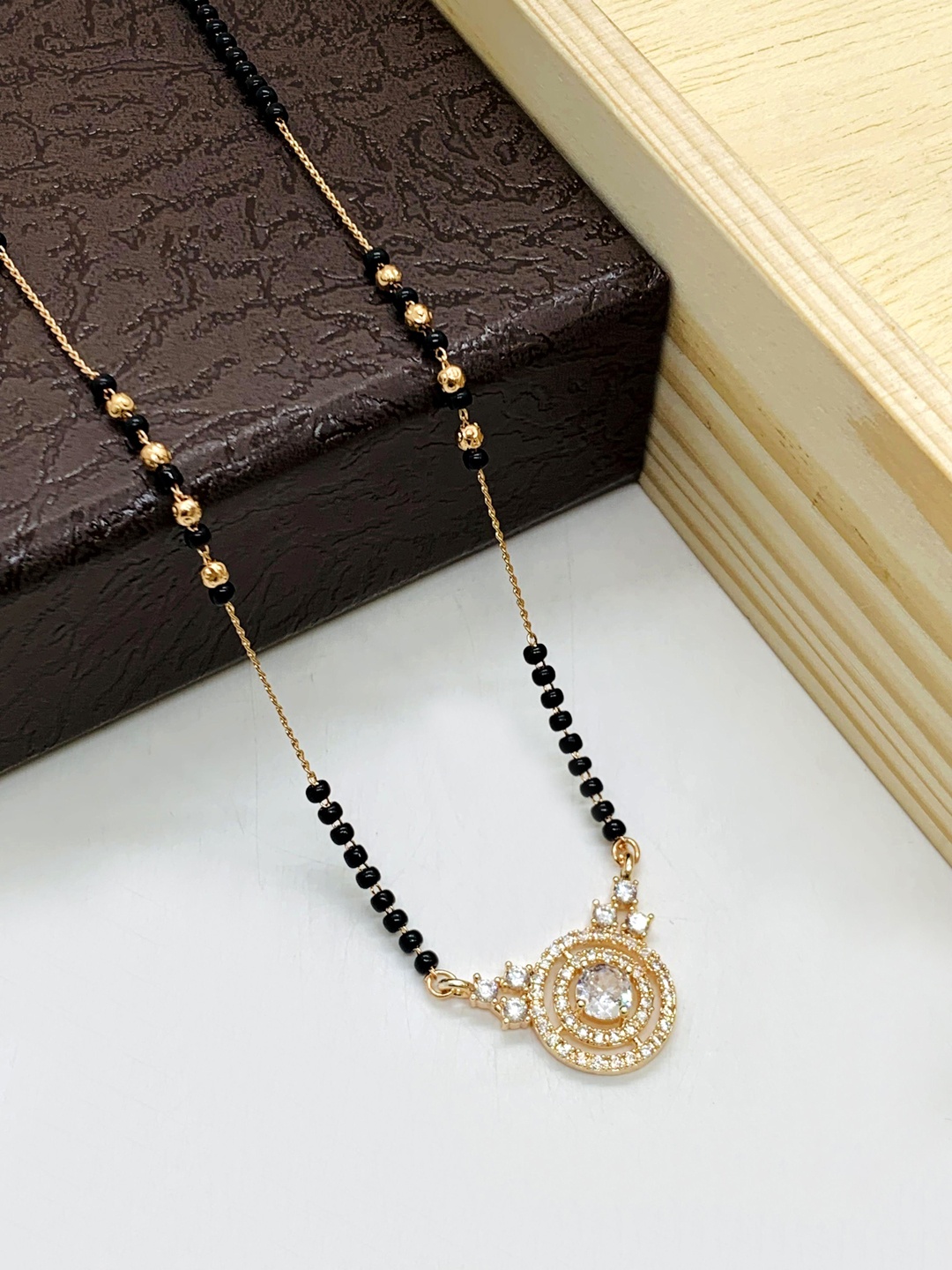 

Wynona Artificial Stones and Beads Mangalsutra, Gold