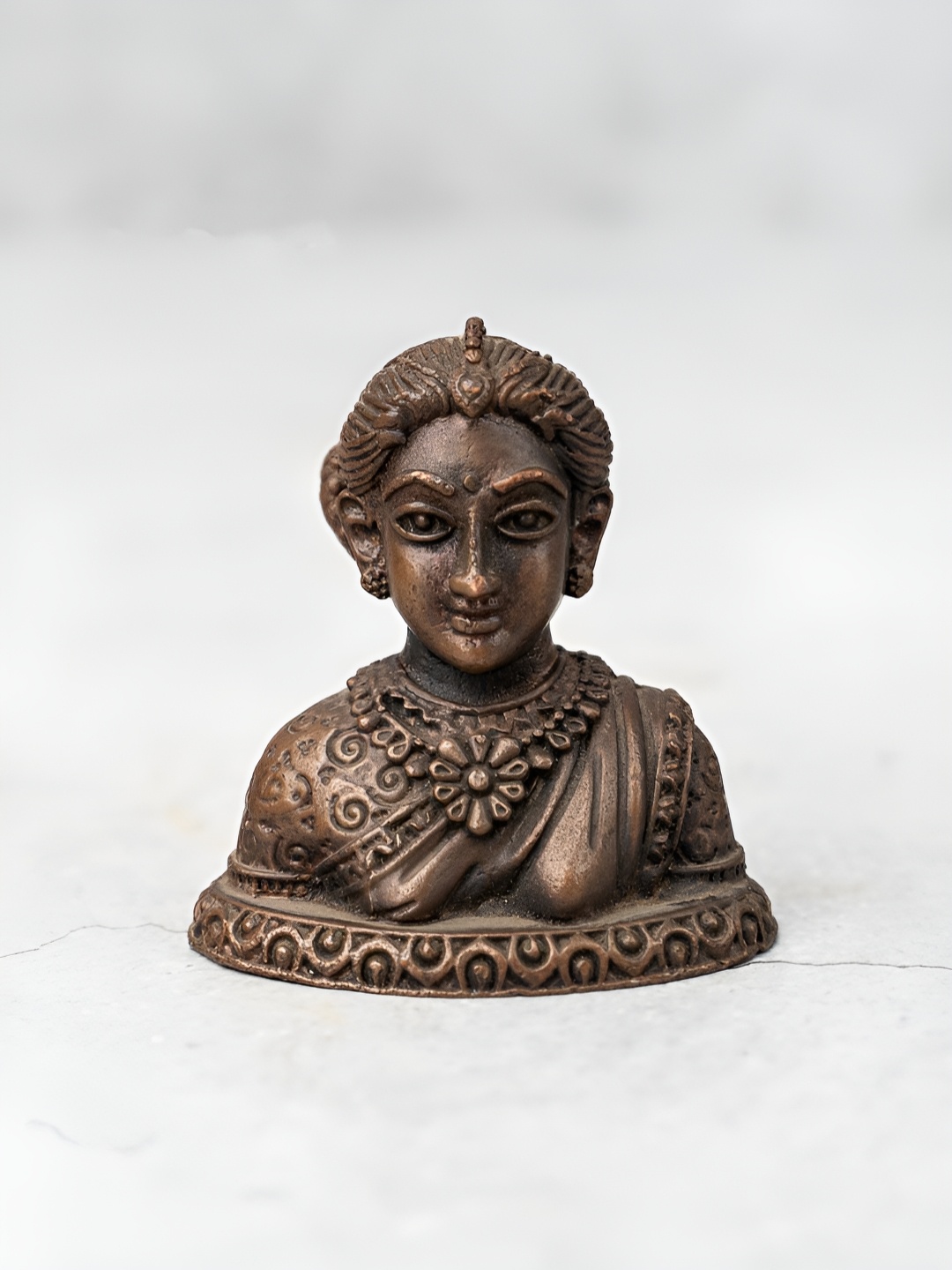 

The Advitya Copper-Toned Religious Curio Showpiece