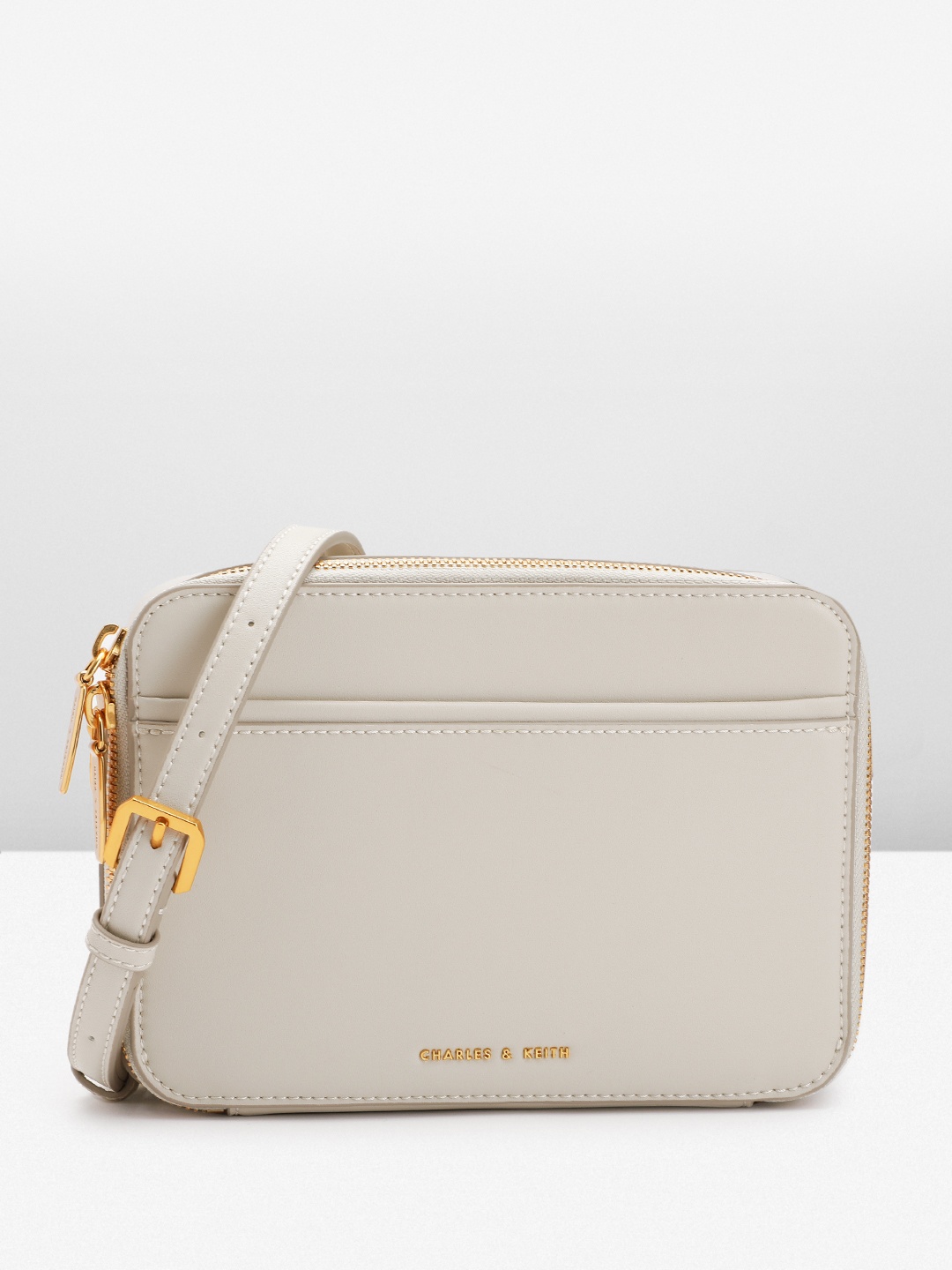 

CHARLES & KEITH Solid Structured Sling Bag, Cream
