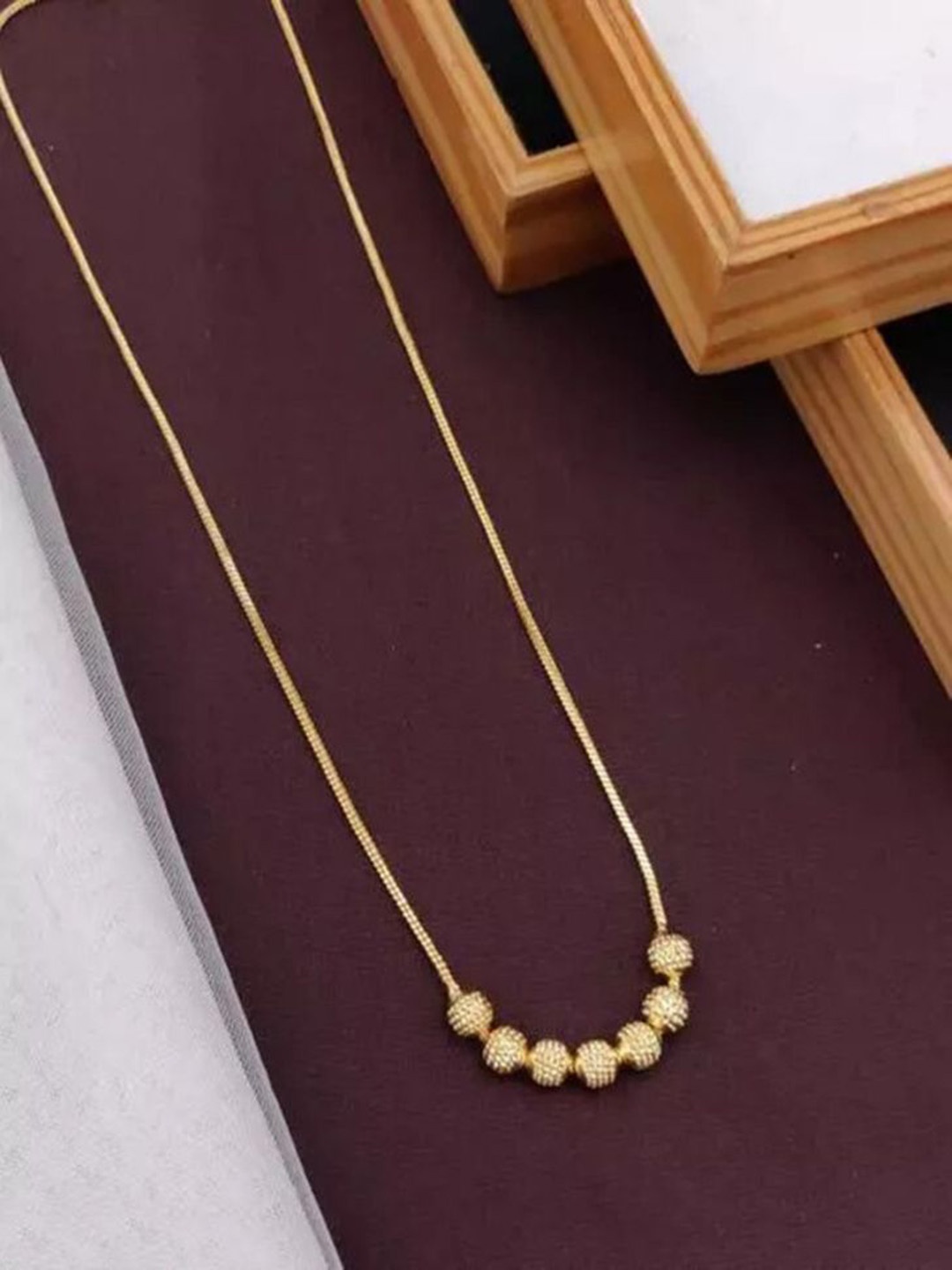 

Wynona Gold-Plated Artificial Stones and Beads Mangalsutra