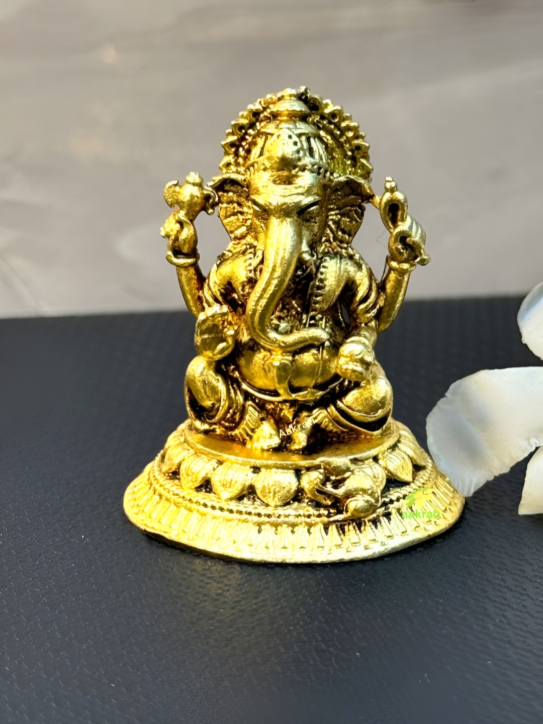 

Aakrati Yellow Lord Ganesha Idol Brass Showpiece