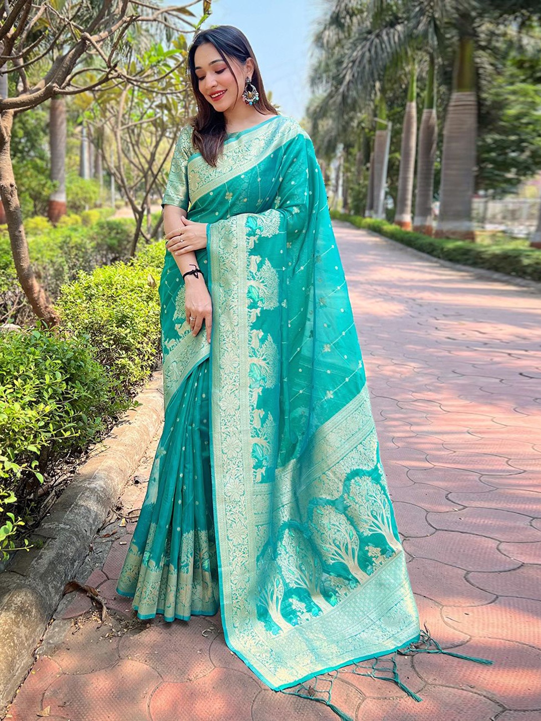 

DEVATITHI Woven Design Zari Organza Saree, Sea green