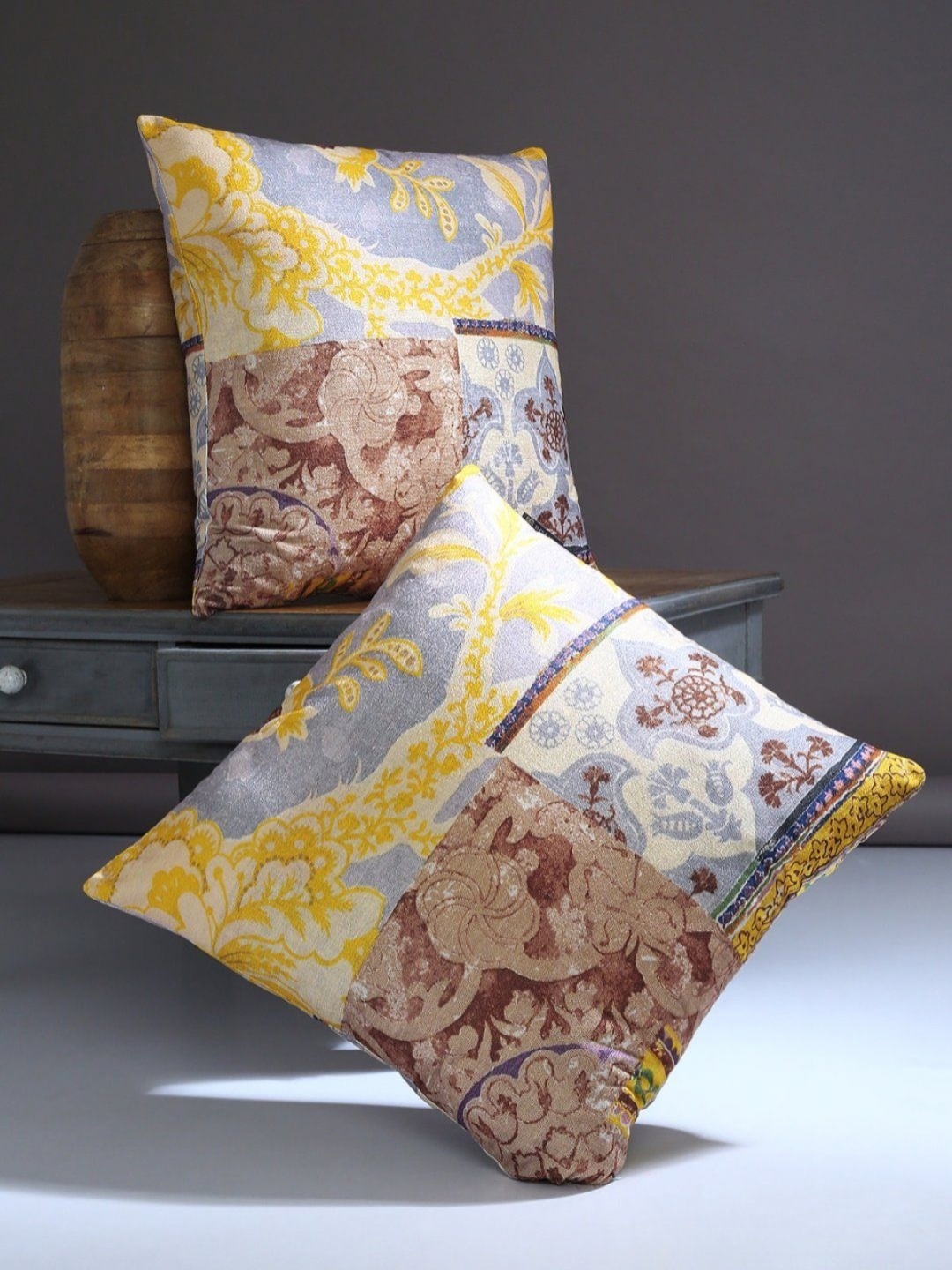 

Myntra Elegant Homes Silver-Toned & Yellow Set of 2 Floral Square Cushion Covers