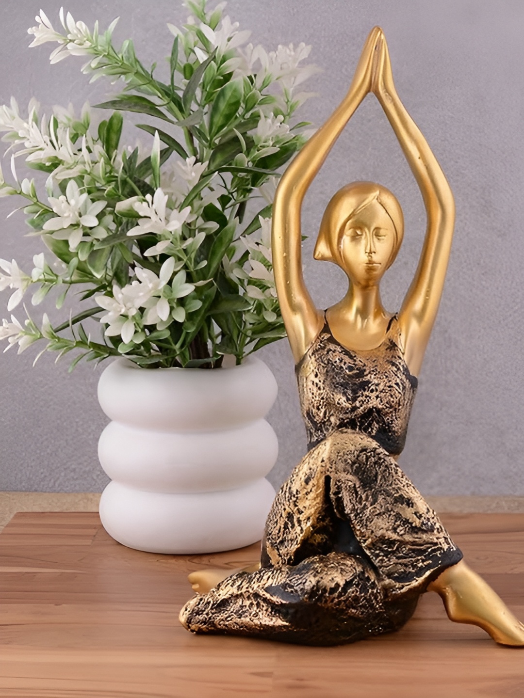 

Zart Black & Gold Toned Yoga Lady Figurine Showpiece