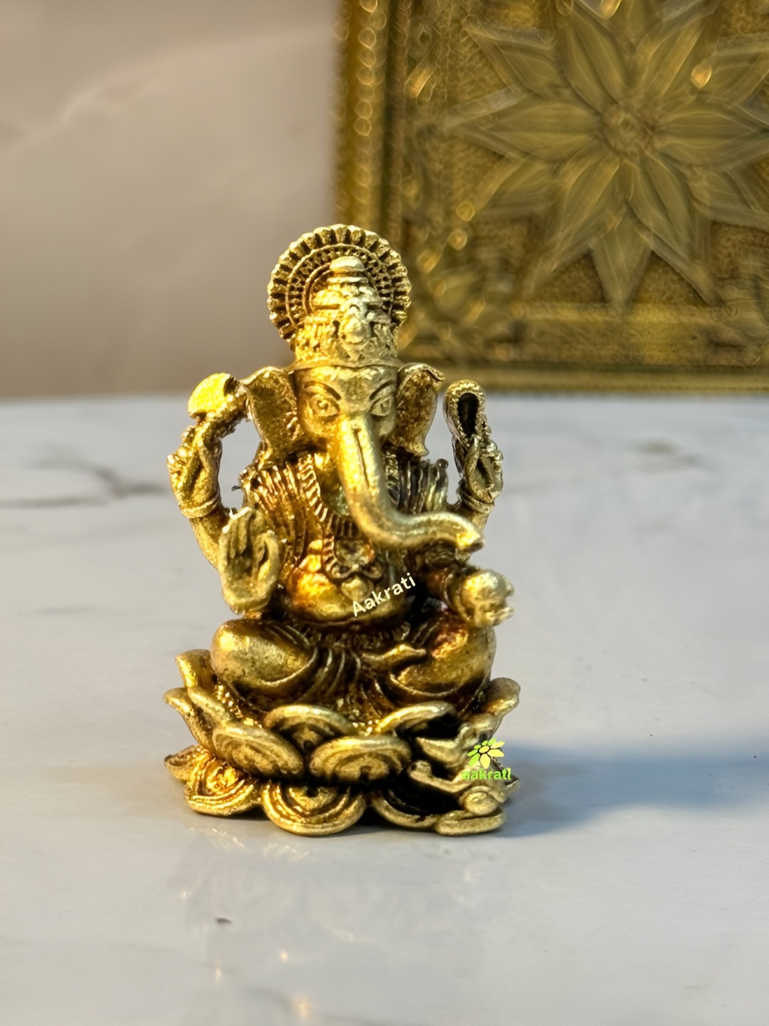 

Aakrati Yellow Lord Ganesha Idol Brass Showpiece