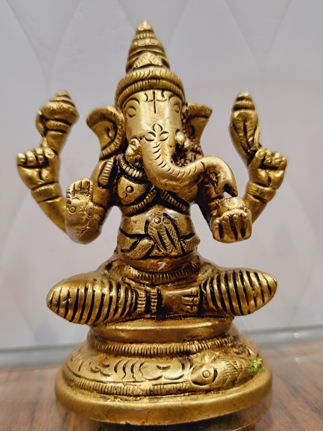 

Aakrati Yellow Lord Ganesha Idol Brass Showpiece