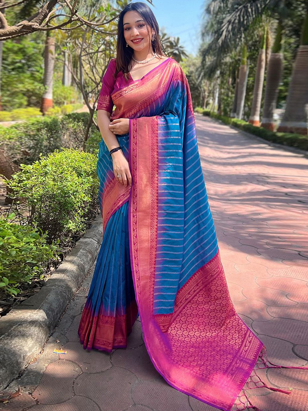 

DEVATITHI Woven Design Zari Silk Blend Banarasi Saree, Blue