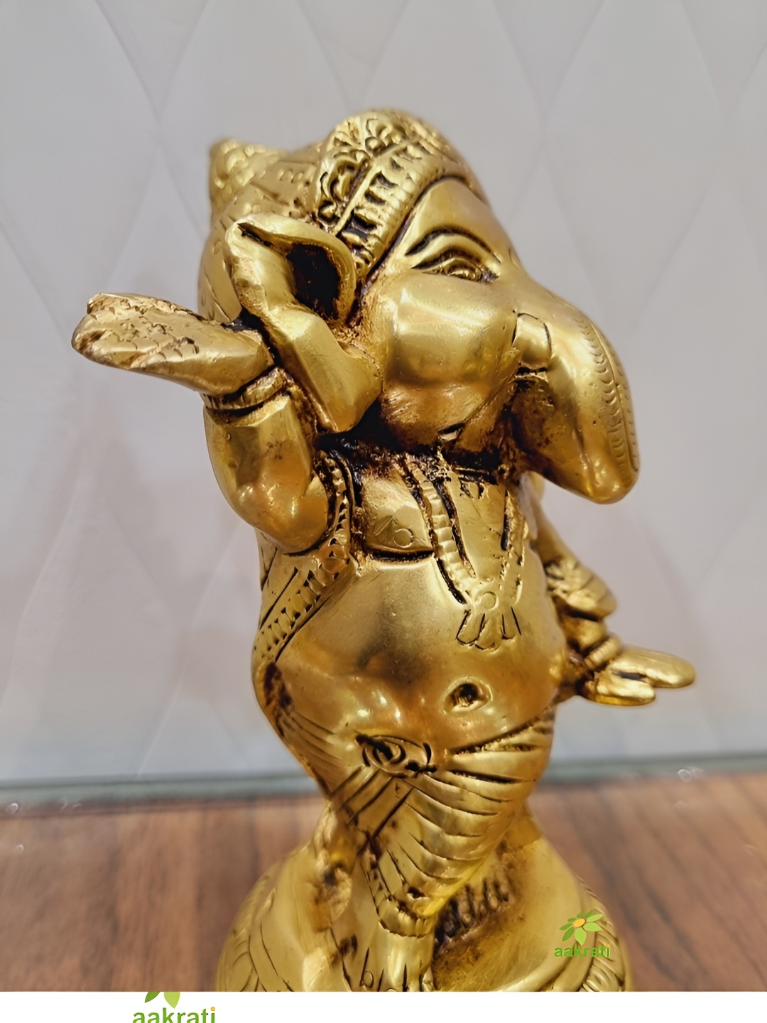 

Aakrati Yellow Lord Ganesha Idol Brass Showpiece