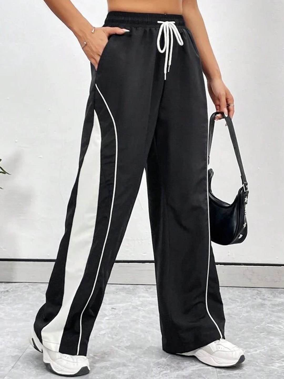 

SAAHASAM Women Striped Relaxed Loose Fit Trousers, Black