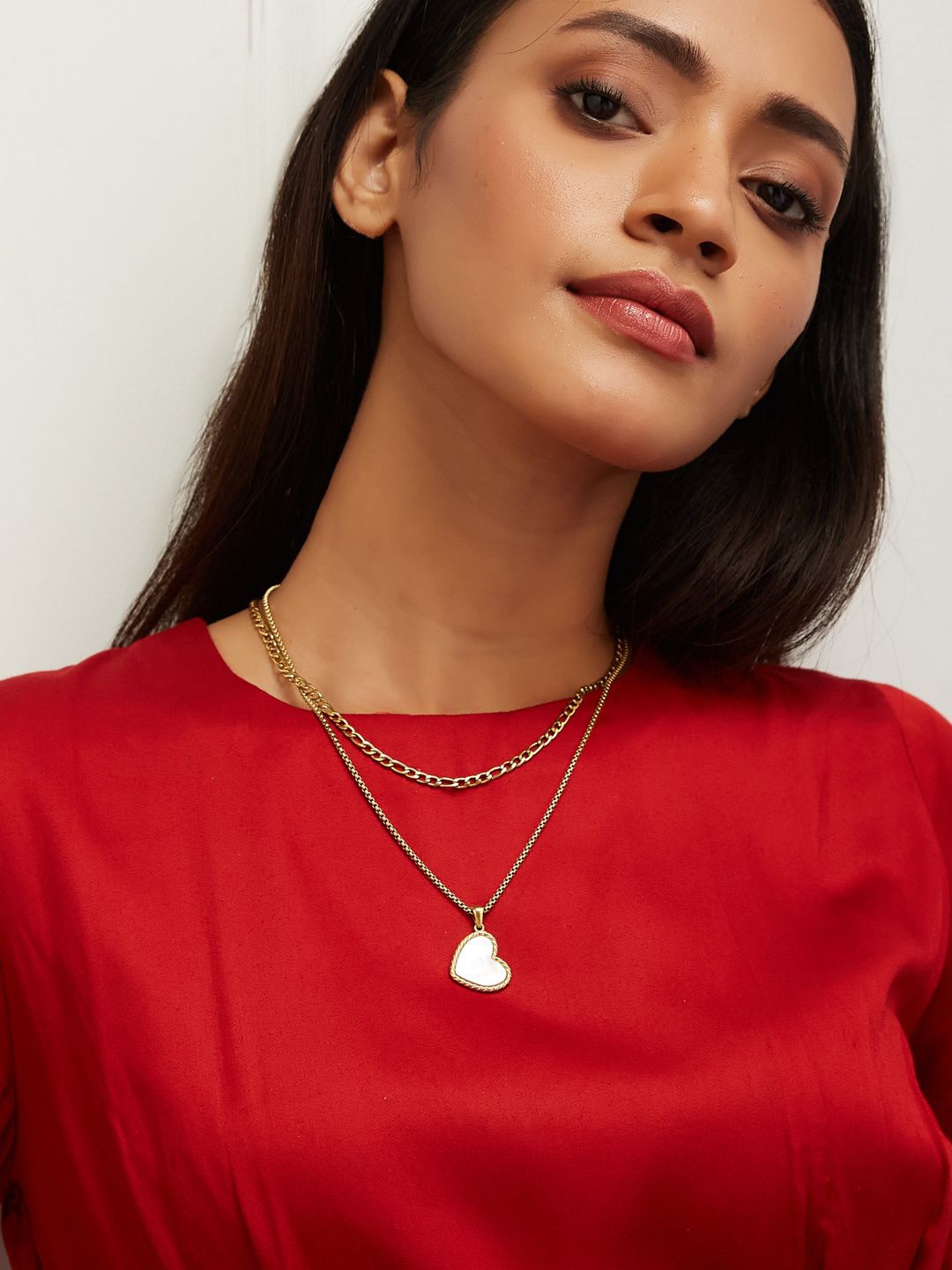 

Yinara Gold-Plated Stainless Steel Heart Shaped Pendant Layered Necklace