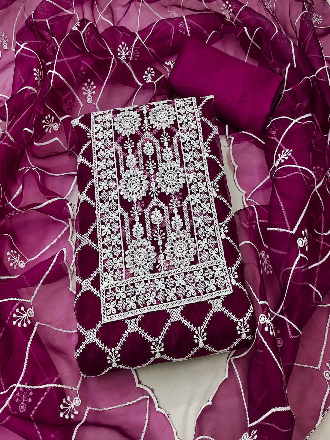 

Maroosh Floral Embroidered Thread Work Organza Unstitched Dress Material, Magenta