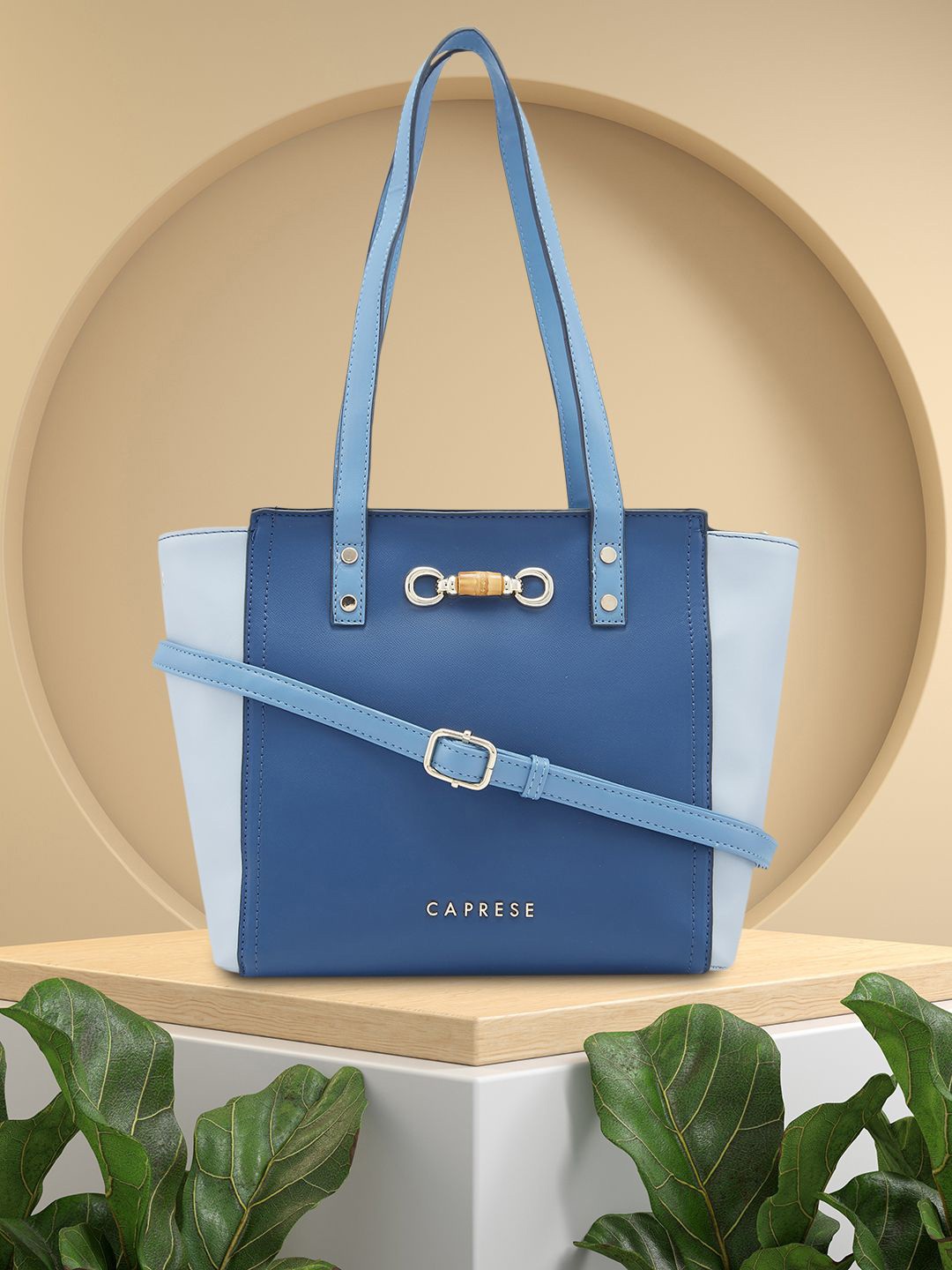 

Caprese Eva Solid Structured Satchel Bag with Bow Detail, Blue