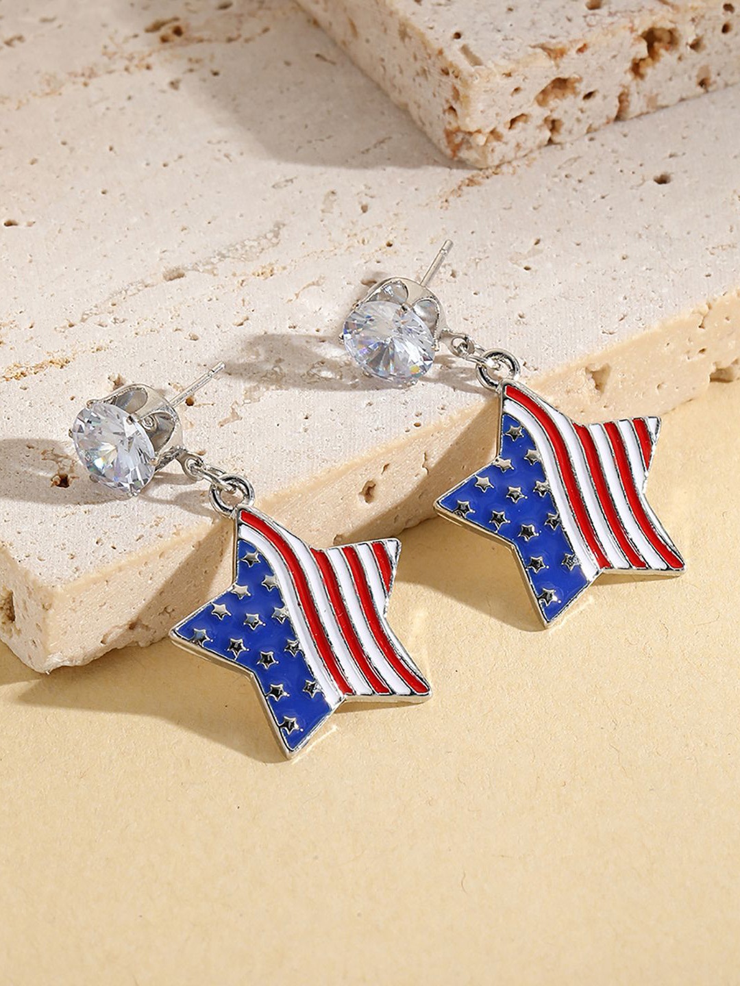 

StyleCast x Revolte Silver-Plated Stones Studded Star Shaped Drop Earrings