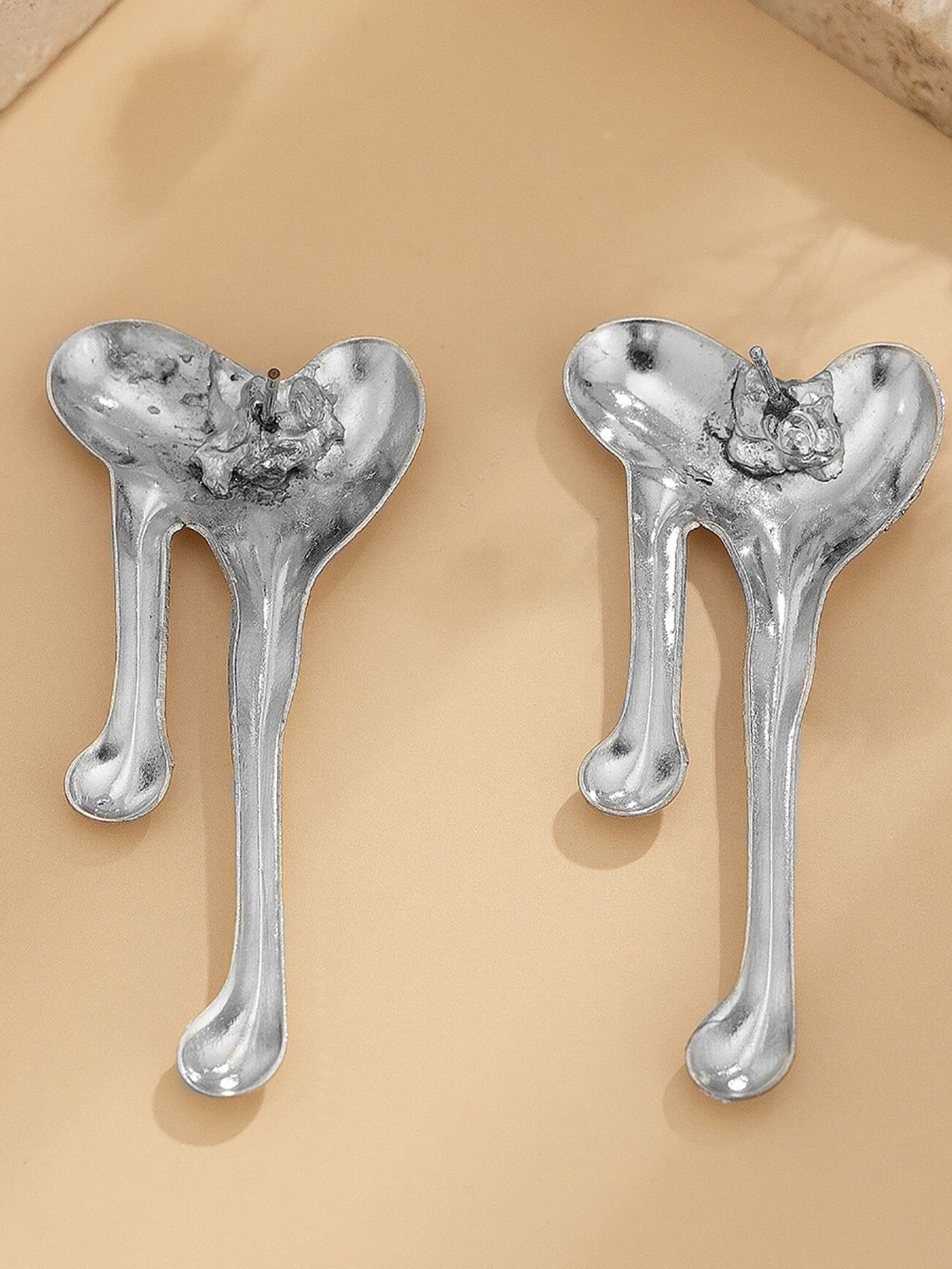 

StyleCast x Revolte Silver-Plated Heart Shaped Drop Earrings