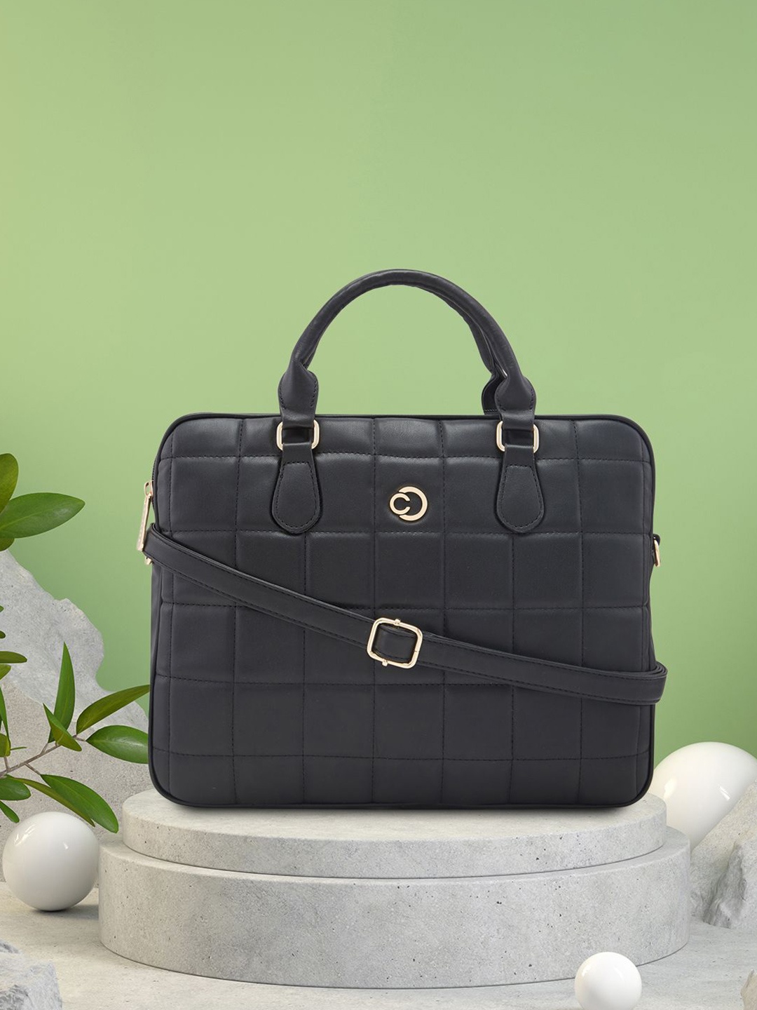 

Caprese Women Textured PU Laptop Sleeve, Black