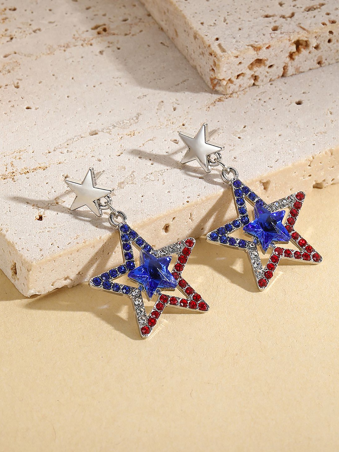

StyleCast x Revolte Silver-Plated Star Shaped Drop Earrings