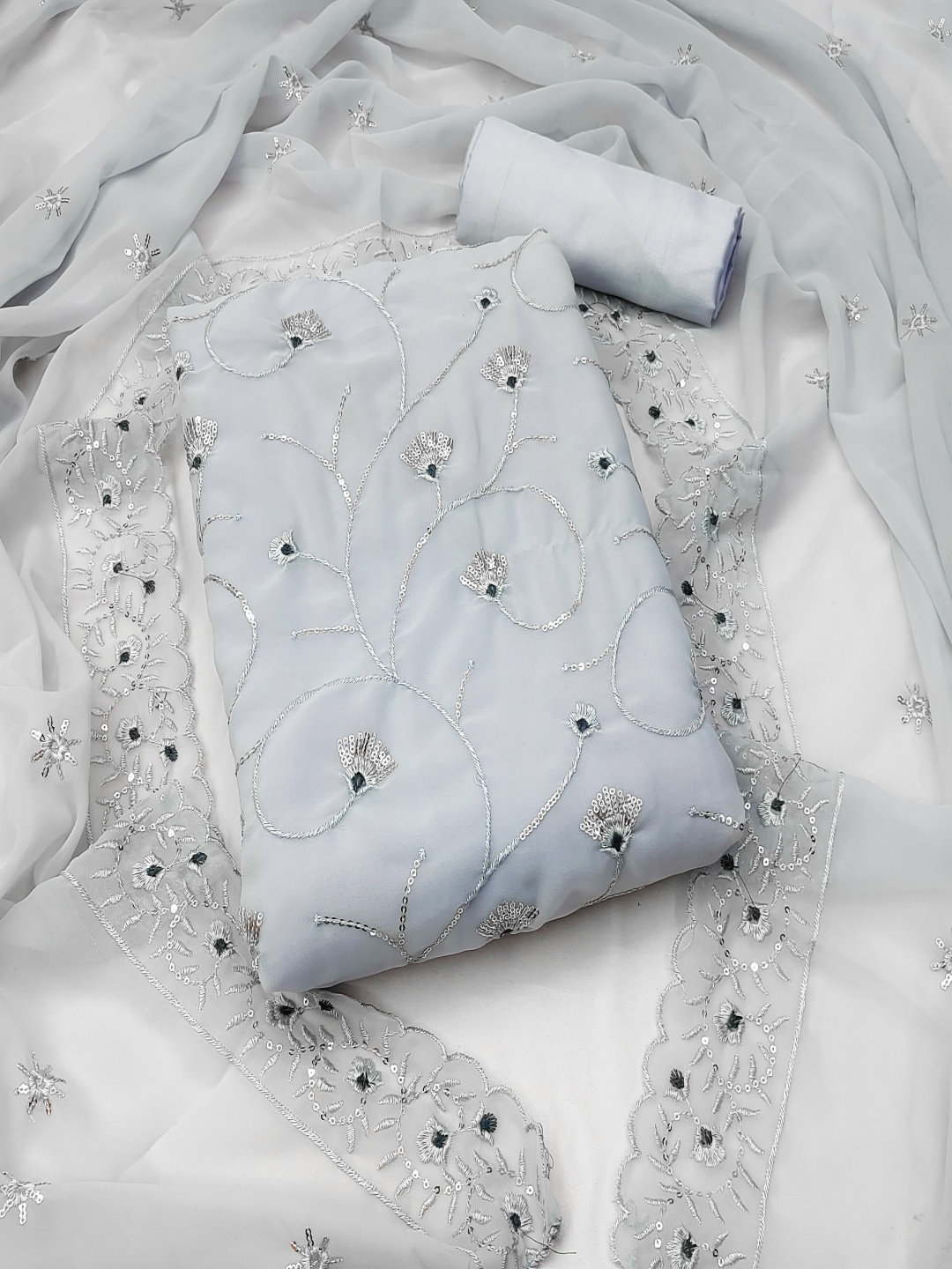 

Maroosh Floral Embroidered Sequinned Unstitched Dress Material, Grey