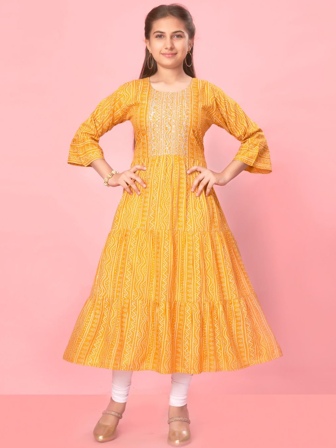 

Sangria Girls Yellow Bandhani Printed Round Neck Sequinned Pure Cotton Kurta With Legging
