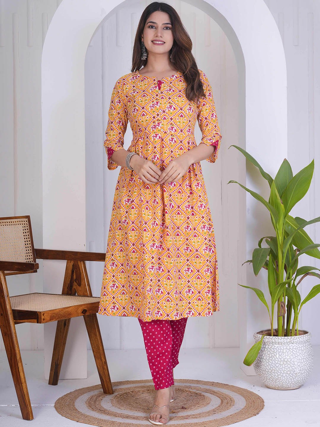 

Assamica Ethnic Motifs Printed Three-Quarter Sleeves A-line Kurta with Trousers, Yellow
