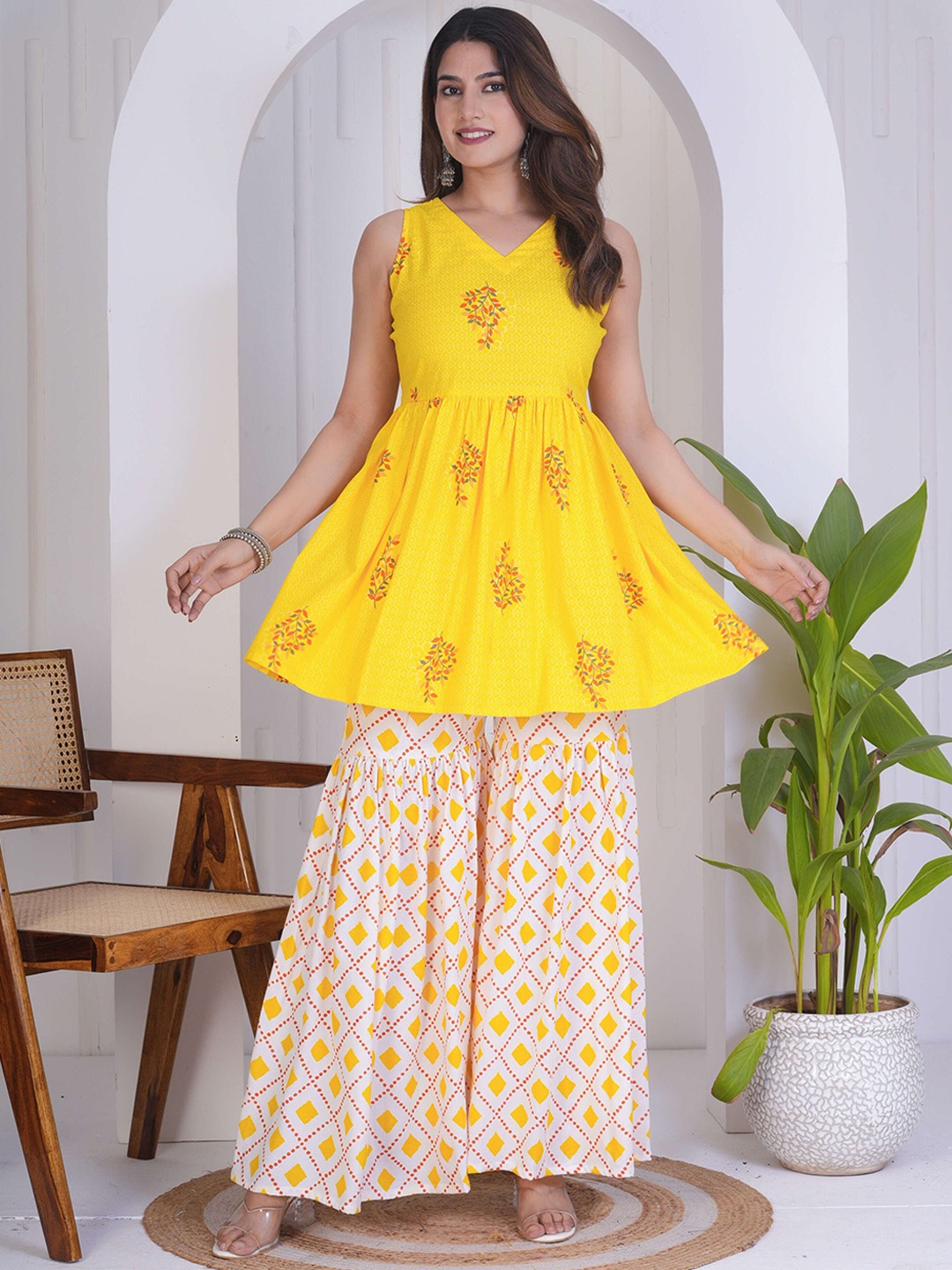 

Kamayra Floral Printed Sleeveless A-Line Pleated Kurti with Sharara, Yellow