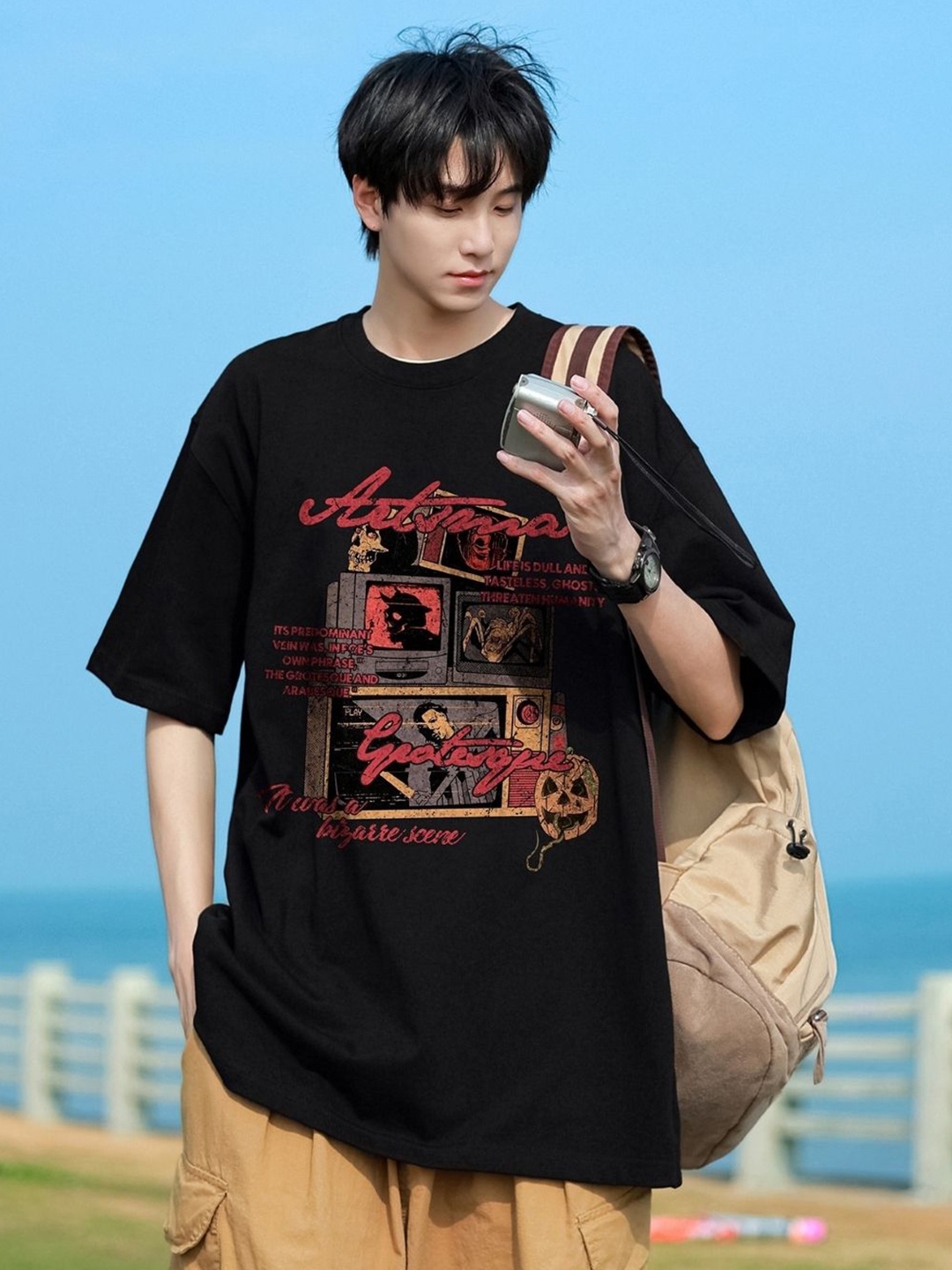 

HERE&NOW Men Graphic Printed Round Neck Cotton Oversized T-shirt, Black