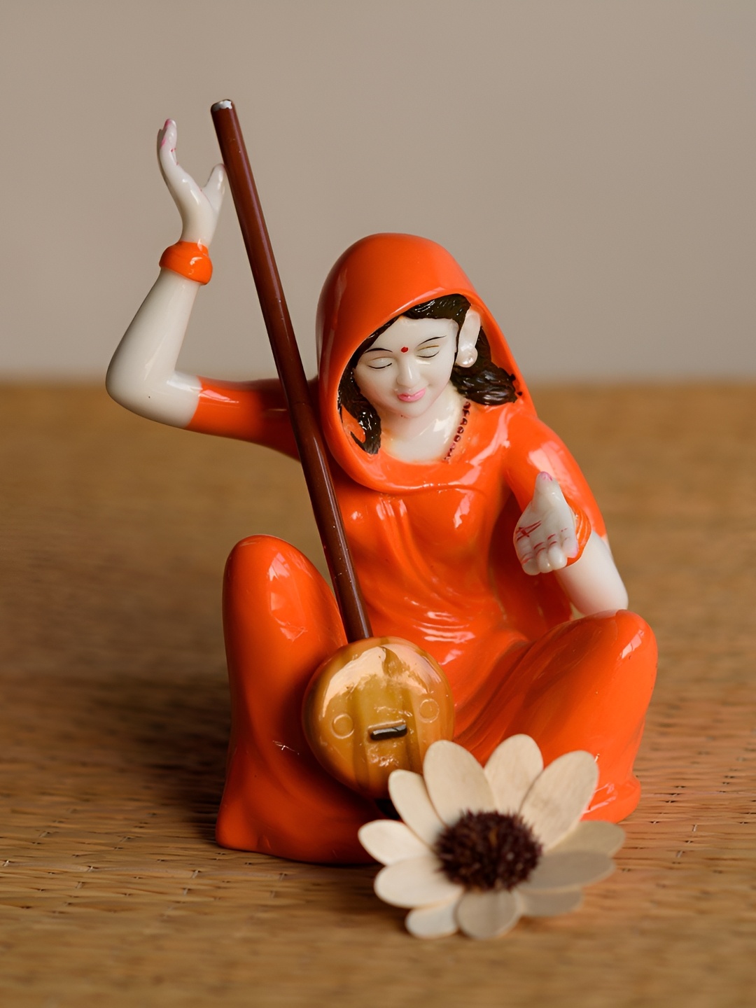 

SANKALAN CREATIONS Orange Coloured Meerabai Devotee Of Lord Krishna Figurine Showpiece