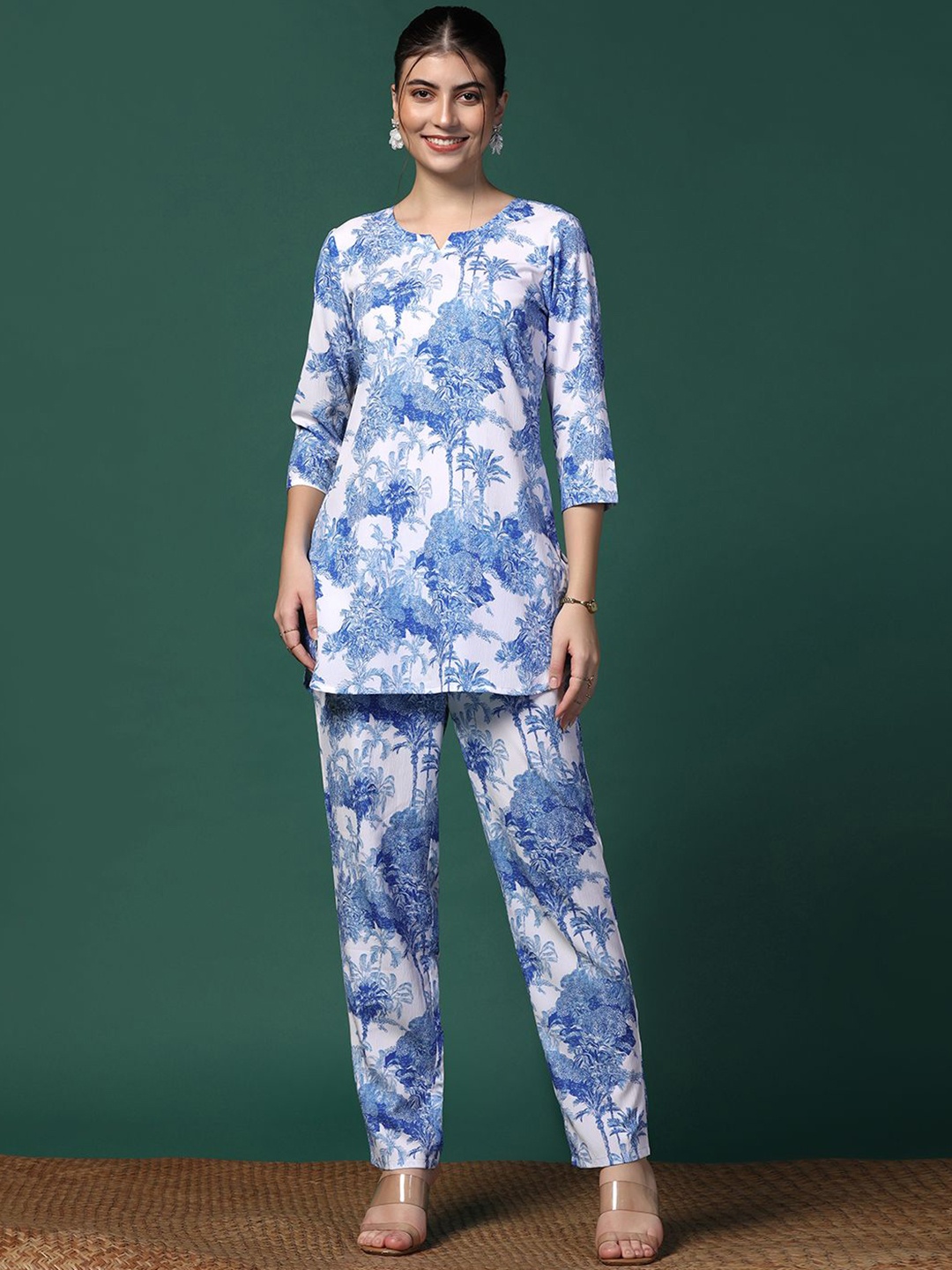 

Moda Rapido White Floral Printed Three-Quarter Sleeves Top With Trousers
