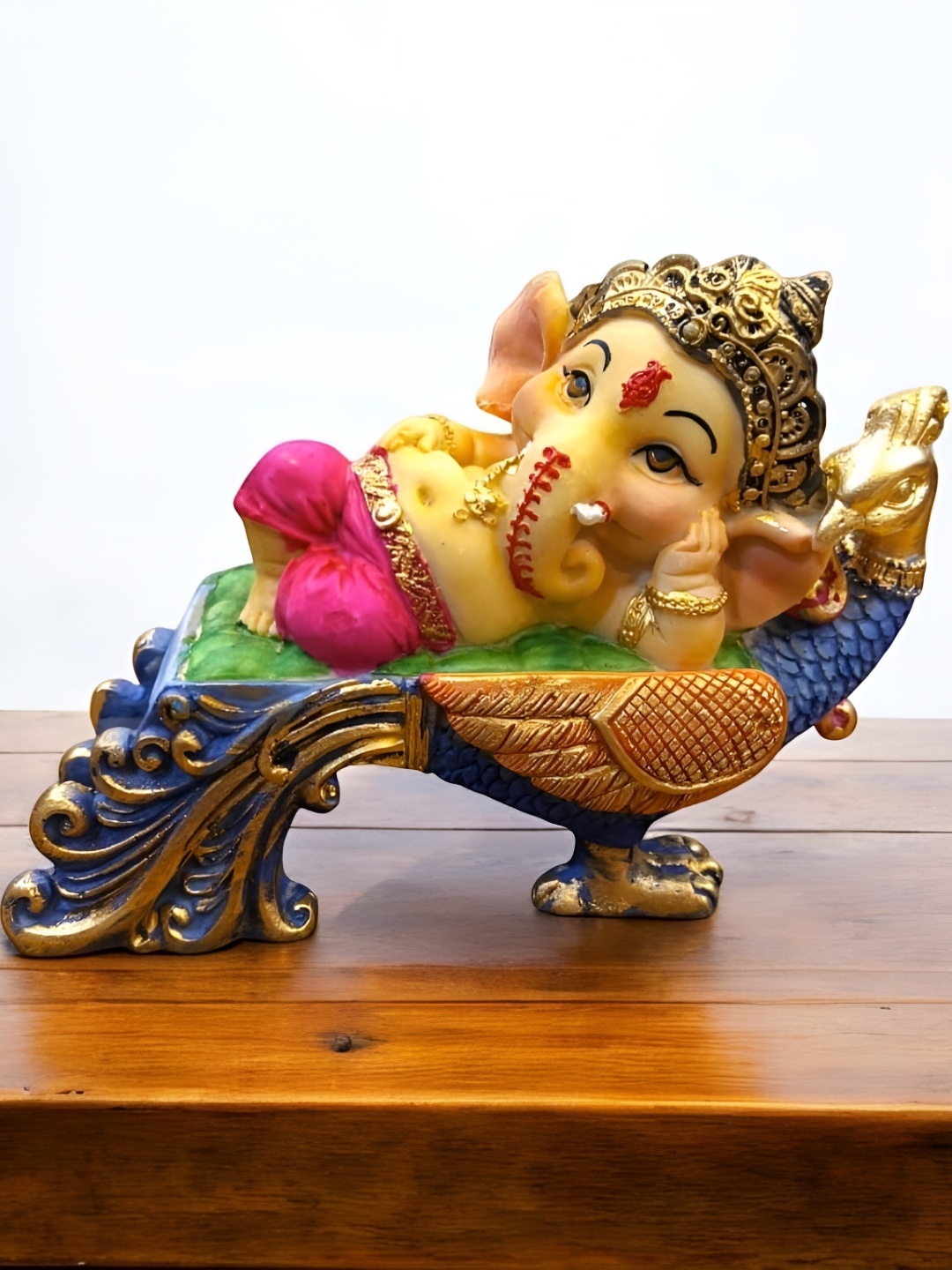 

SANKALAN CREATIONS Gold-Toned & Blue Peacock Ganesha Idol Showpiece