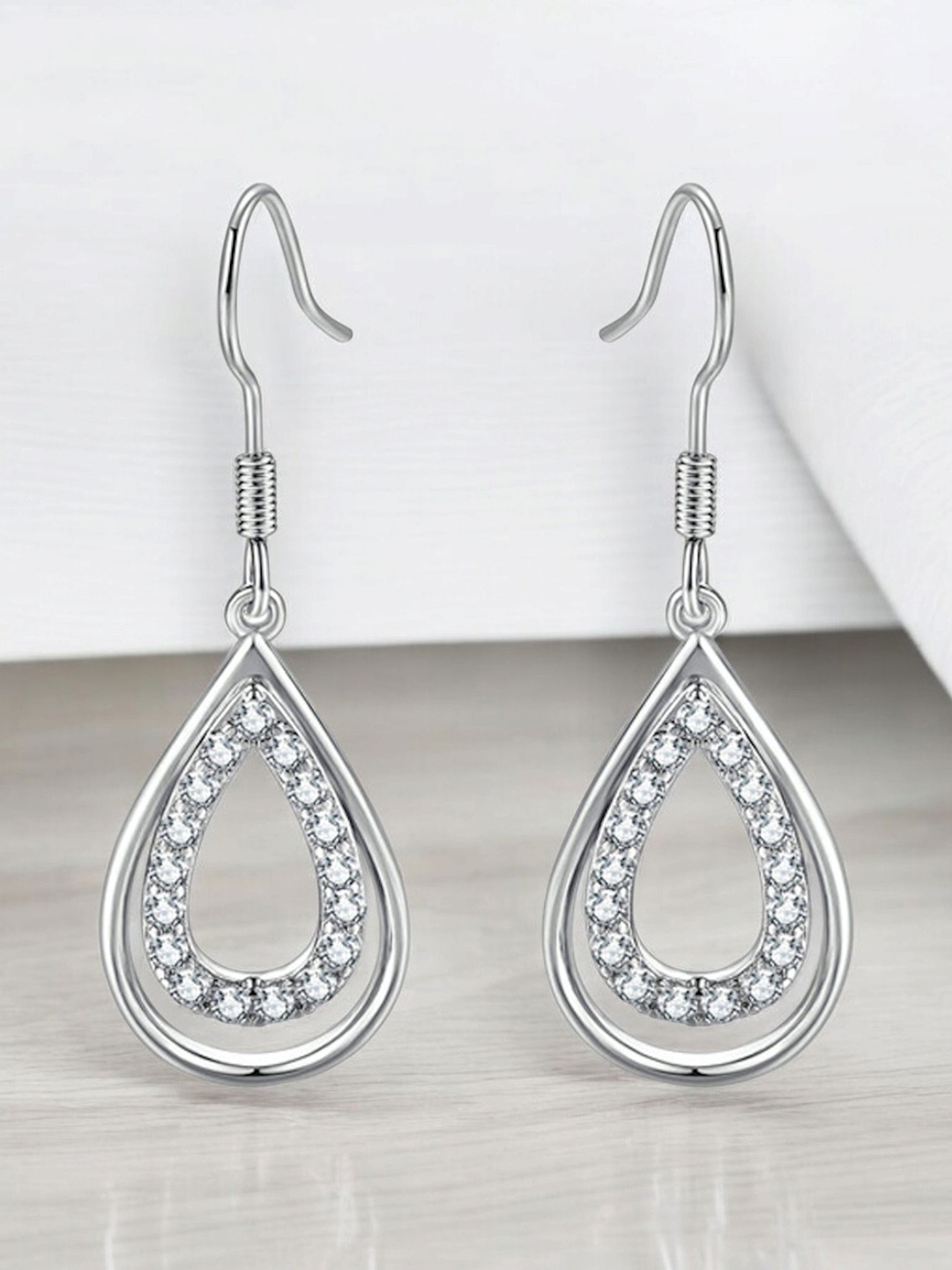 

Nilu's Collection Silver-Plated Teardrop Shaped Cubic Zirconia Drop Earrings