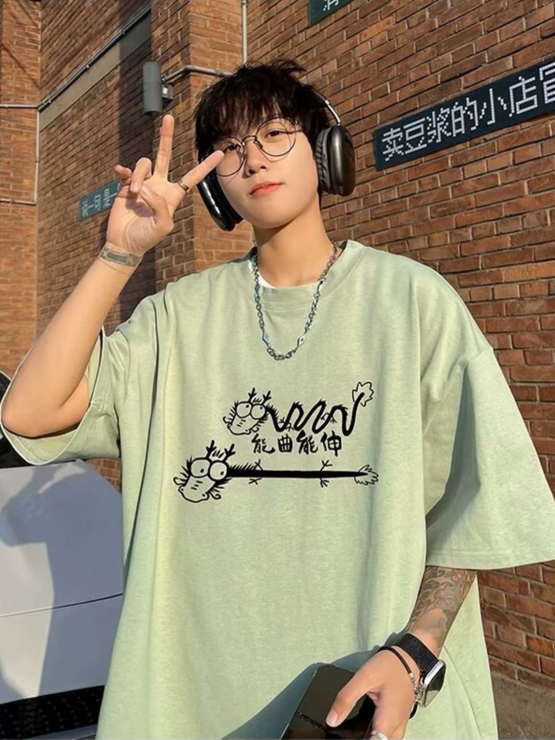 

HERE&NOW Men Graphic Printed Round Neck Oversized T-shirt, Green