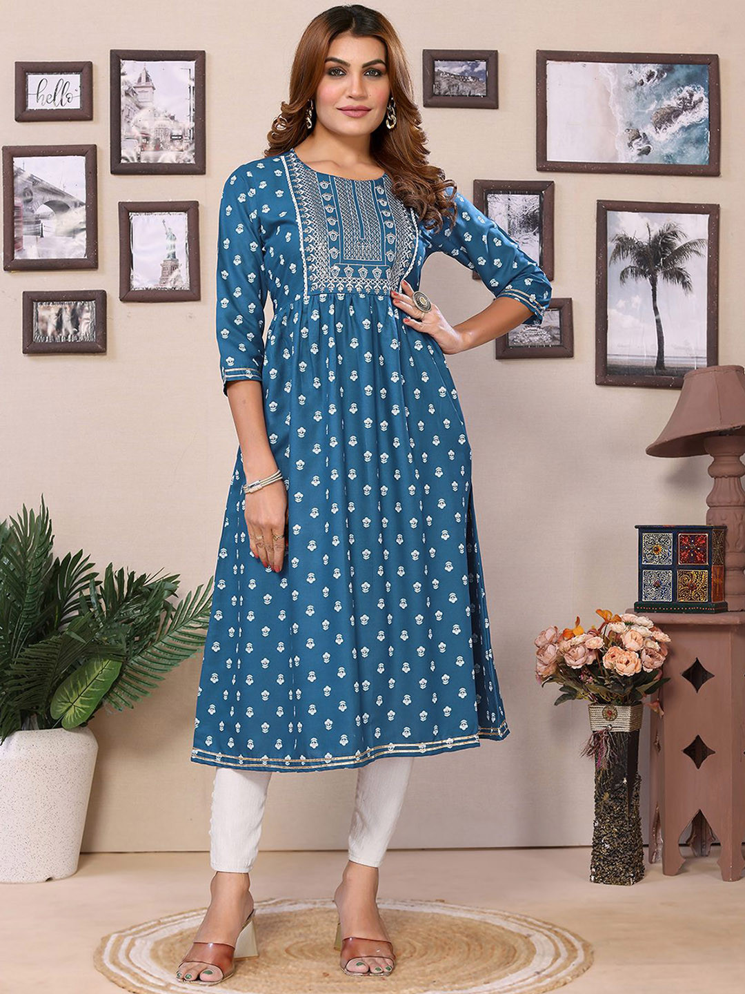 

Rangita Floral Printed Round Neck Three-Quarter Sleeves Regular Thread Work Anarkali Kurta, Teal