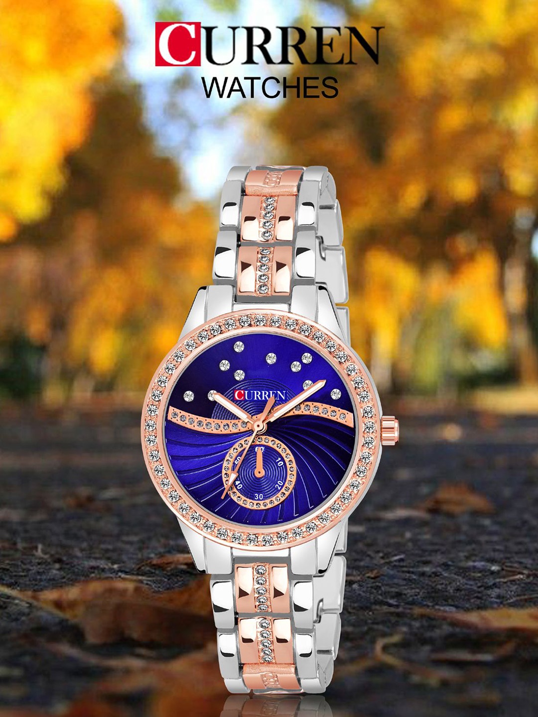 

Curren Women Brass Embellished Dial Reset Time Around Straps Analogue Watch CR-1342-TT-BL, Blue