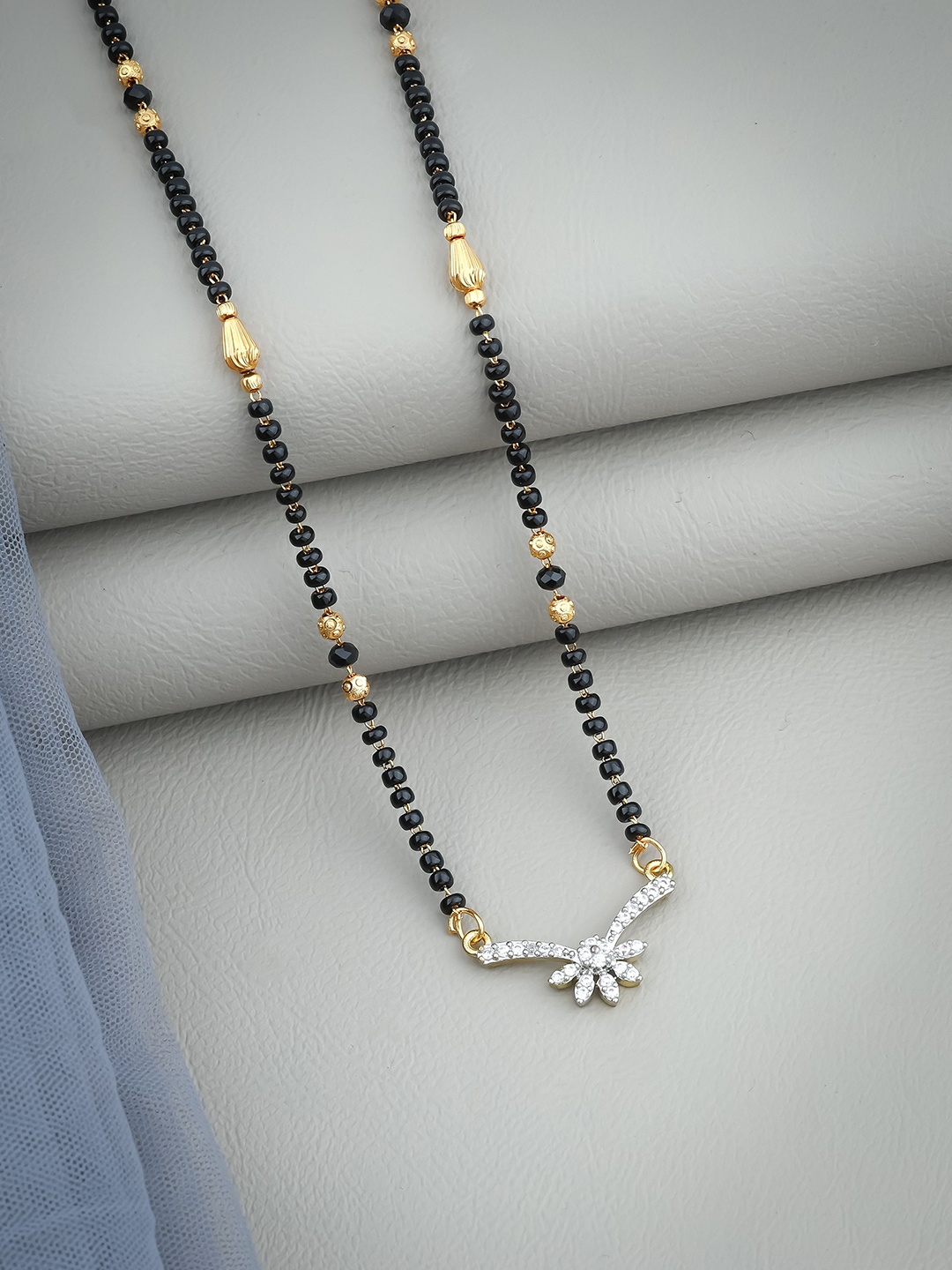 

Wynona Gold Plated American Diamond Stone Studded & Beaded Mangalsutra