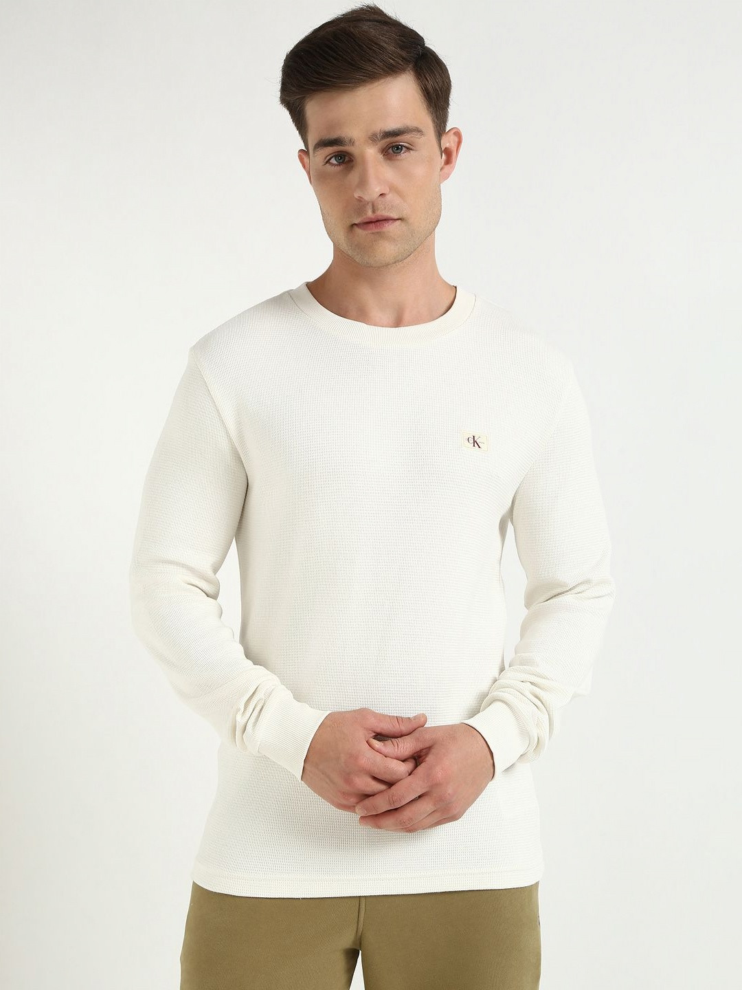 

Calvin Klein Jeans Men Self Design Round Neck Cotton T-shirt, Off white