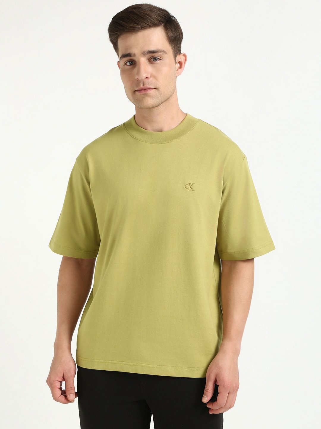 

Calvin Klein Jeans Men Solid Round Neck Cotton Oversized T-shirt, Green