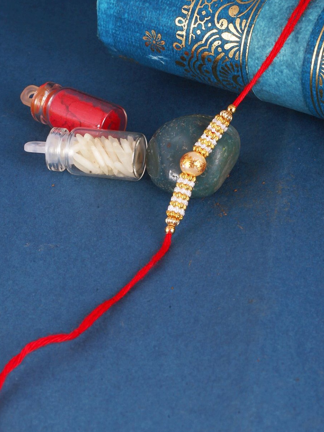 

Vighnaharta Thread Rakhi, Gold