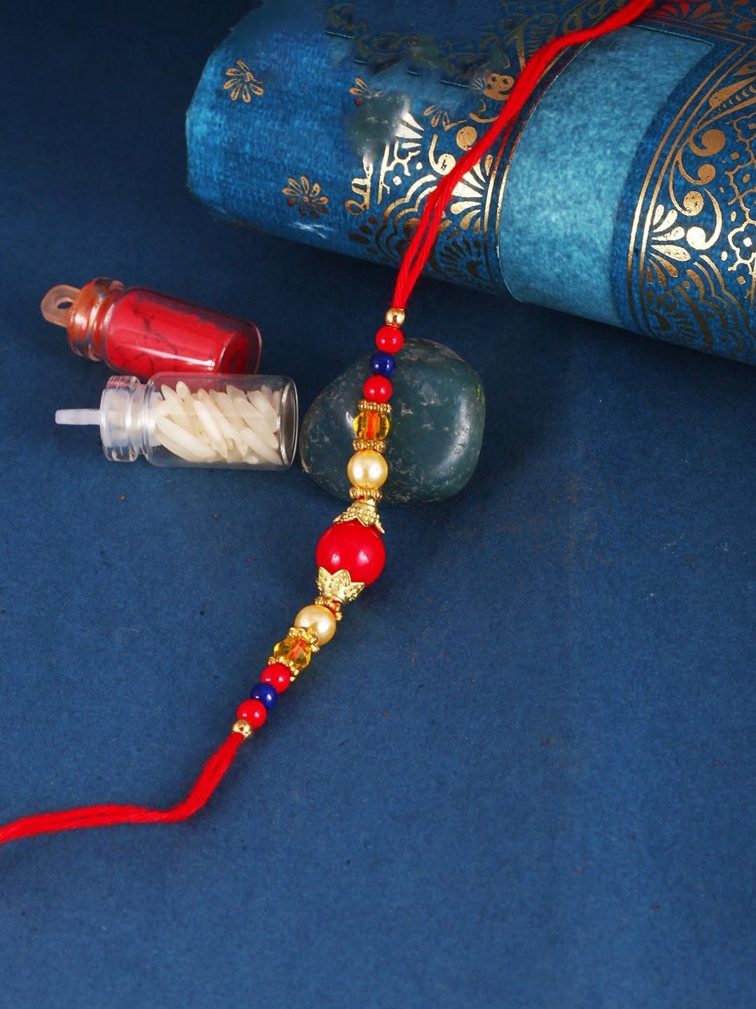 

Vighnaharta Thread Rakhi, Gold