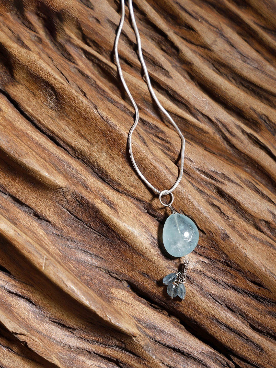 

Exotic India Silver-Plated Oval Pendants, Blue