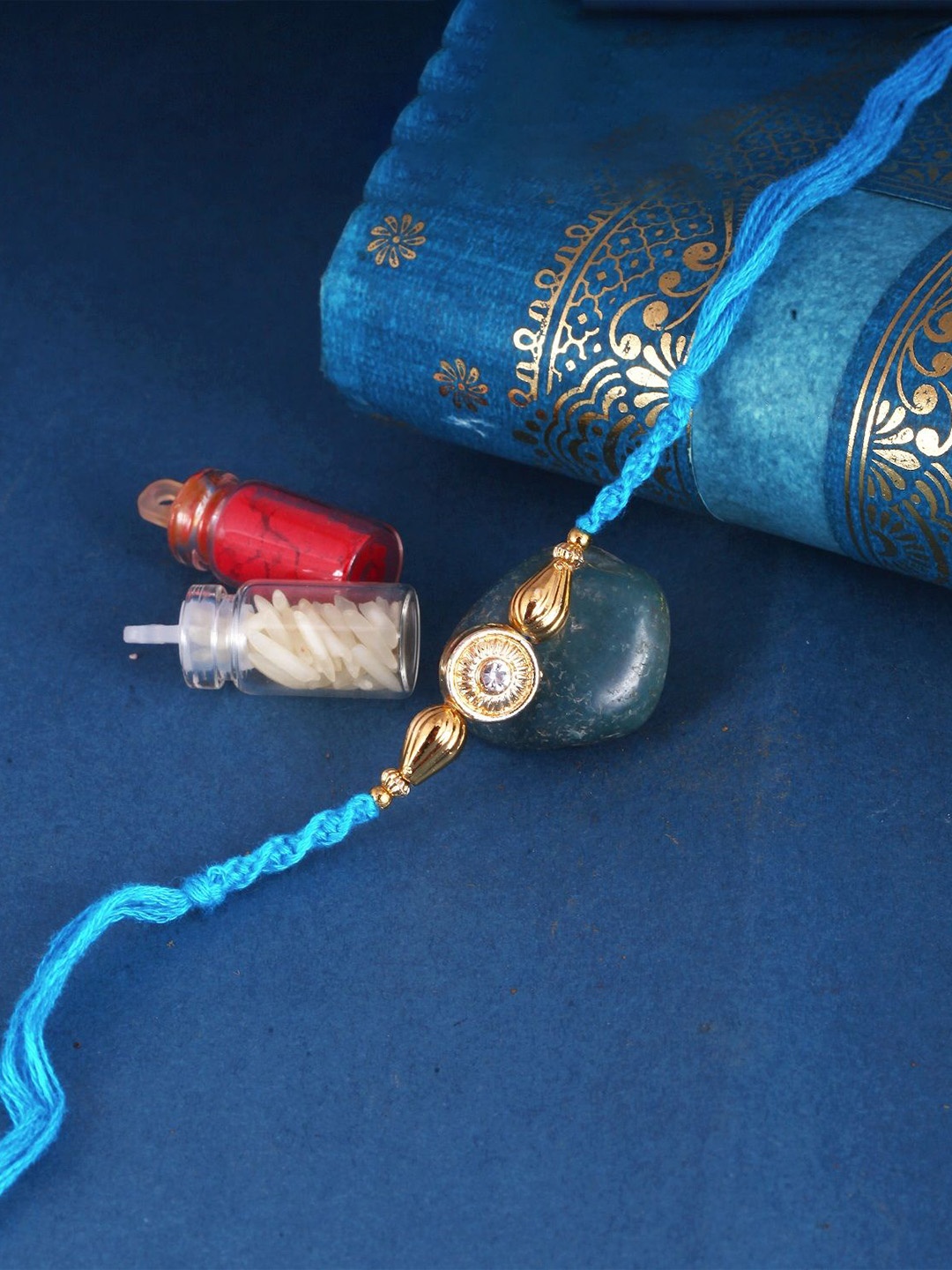 

Vighnaharta Thread Rakhi, Gold