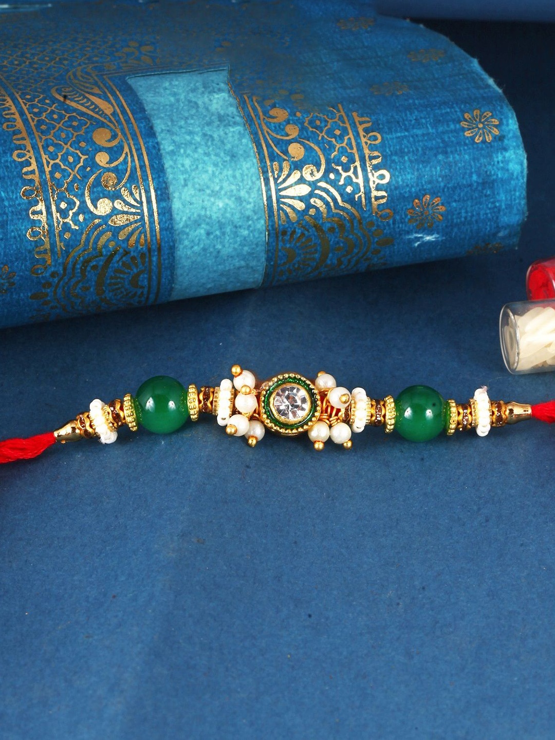 

Vighnaharta Thread Rakhi, Gold