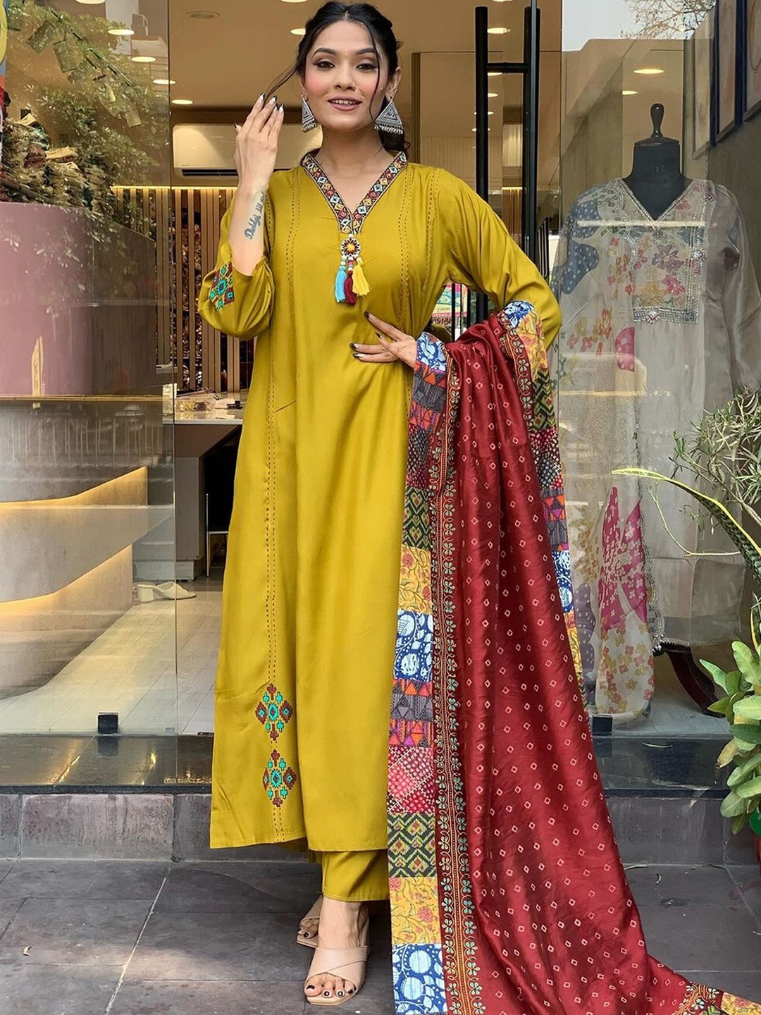 

KALINI Women Ethnic Motifs Yoke Design Regular Thread Work Kurta with Trousers & With Dupatta, Mustard