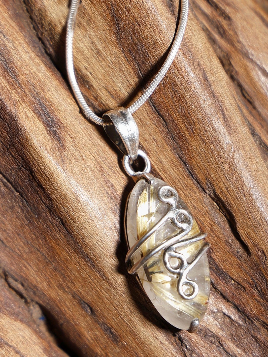 

Exotic India Star Rutile Gemstone Wire Wrapped Sterling Silver Pendant