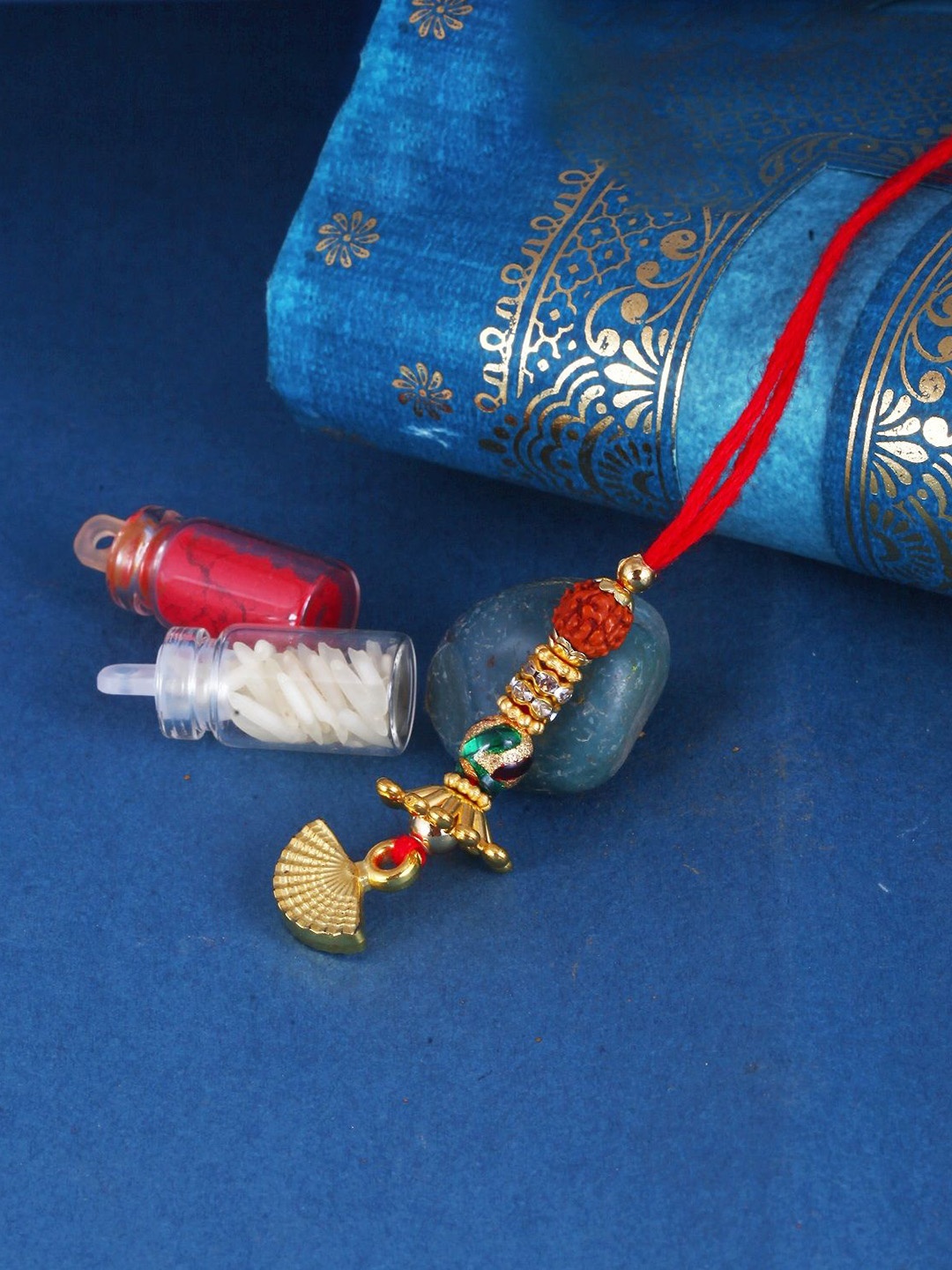 

Vighnaharta Thread Rakhi, Gold