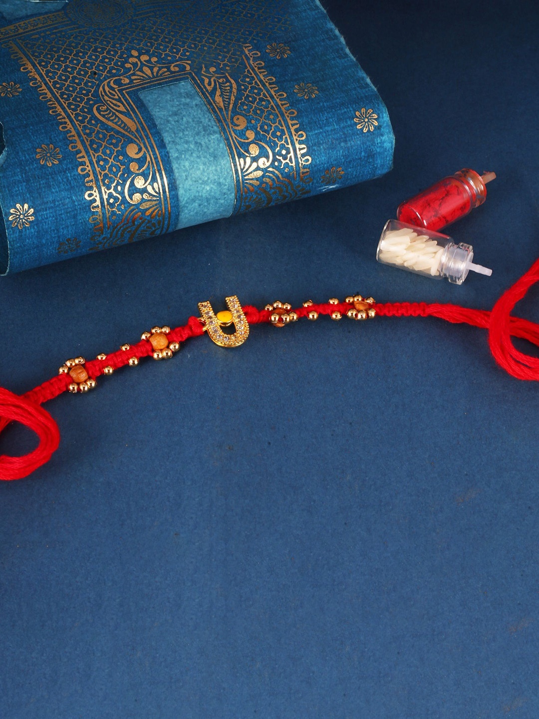 

Vighnaharta Thread Rakhi, Gold