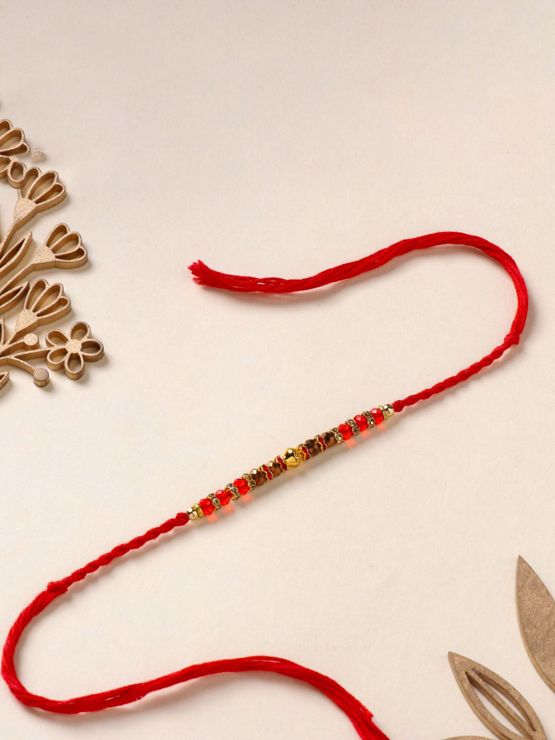 

Floweraura Stunning Beaded Thread Bracelet Rakhi with Roli Chawal, Gold