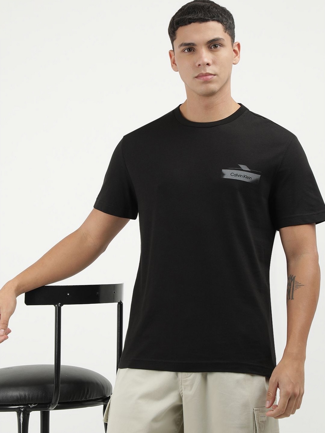 

Calvin Klein Jeans Men Graphic Printed Round Neck Cotton T-shirt, Black