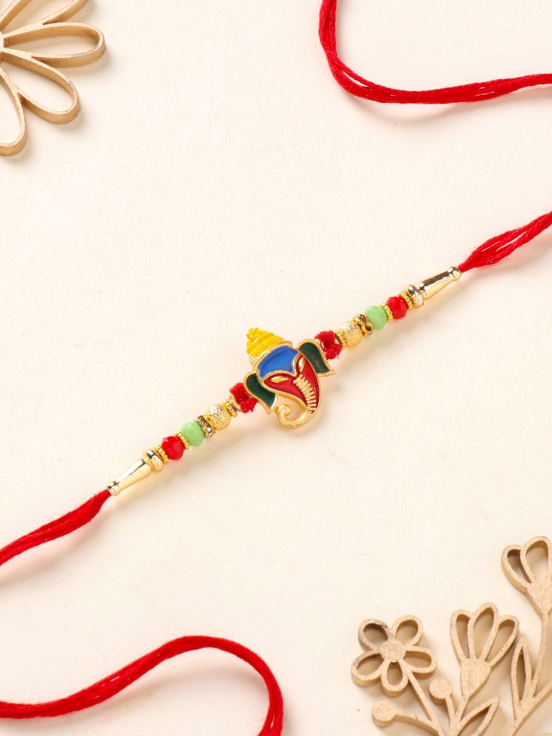 

Floweraura Vibrant Ganesha Rakhi Bracelet With Roli Chawal, Red