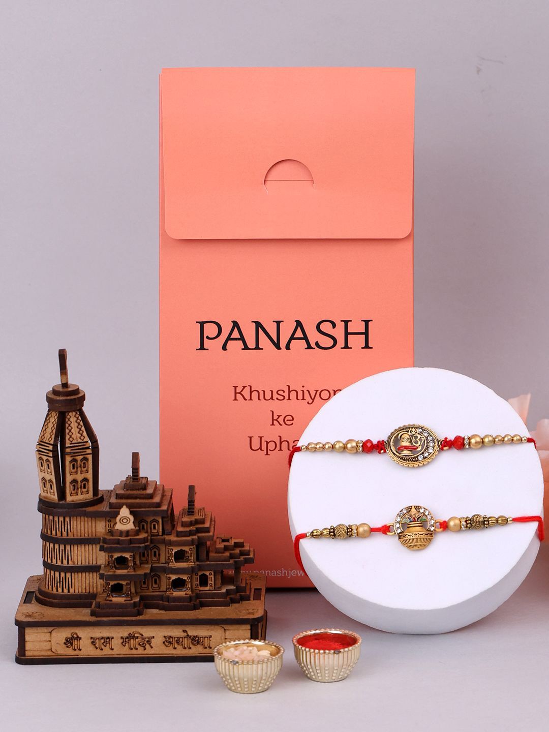 

PANASH Set Of 2 Beaded Rakhis With Showpiece And Roli Chawal, Red