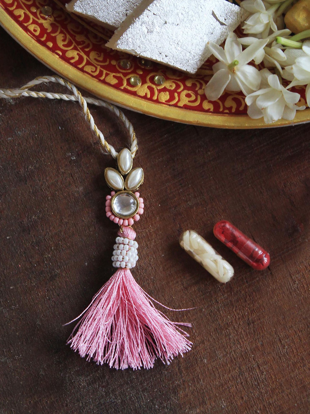 

BeAbhika Kundan Studded Bhabhi Lumba Rakhi With Roli Chawal, Pink